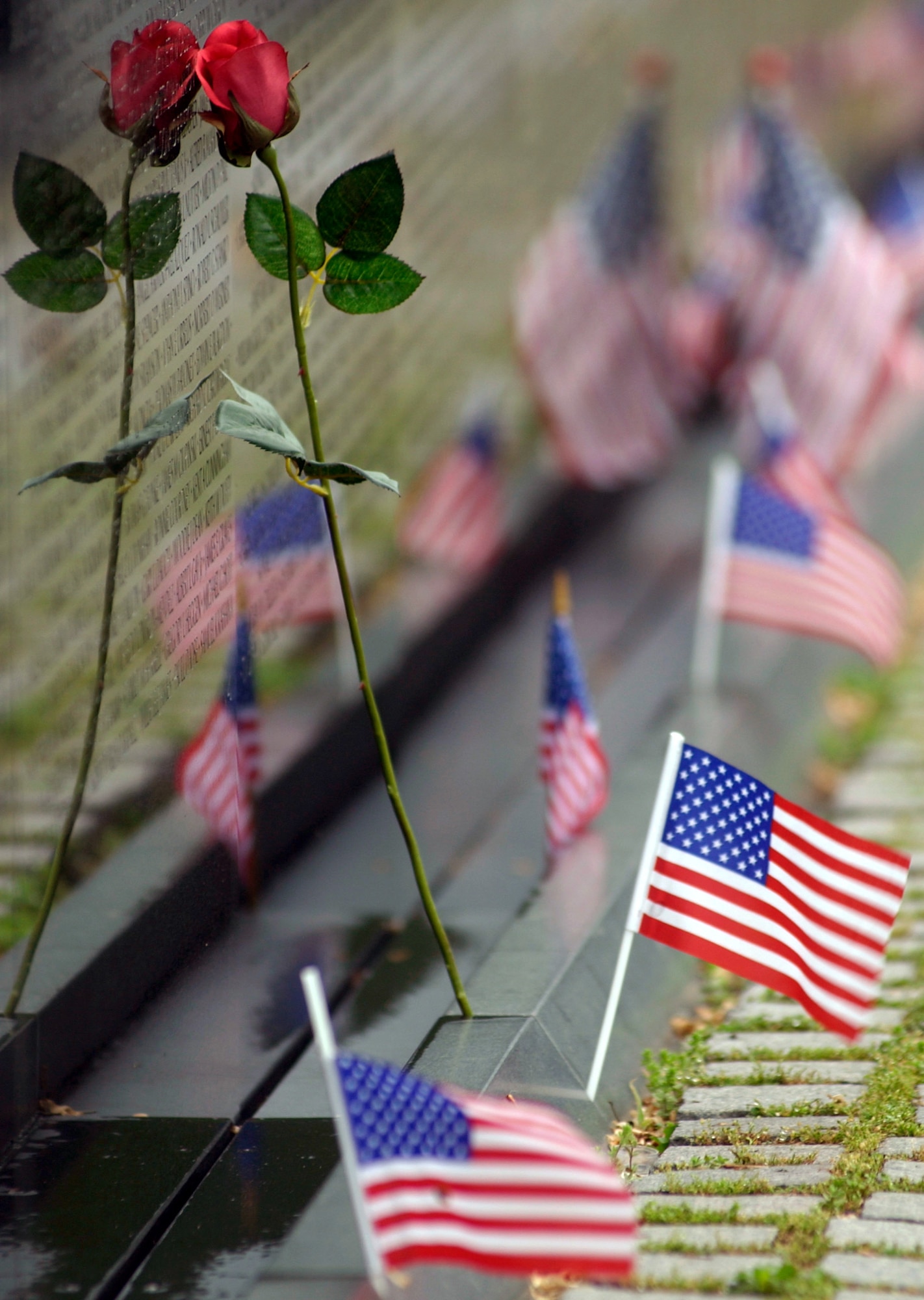 WASHINGTON (AFPN) -- Prisoners of war and those missing in action are remembered Sept. 16 on national POW/MIA Recognition Day.  At the Vietnam War Memorial here, people leave behind patriotic and sentimental symbols of a nation's gratitude for veterans' sacrifices.  (U.S. Air Force photo by Master Sgt. Jim Varhegyi)
