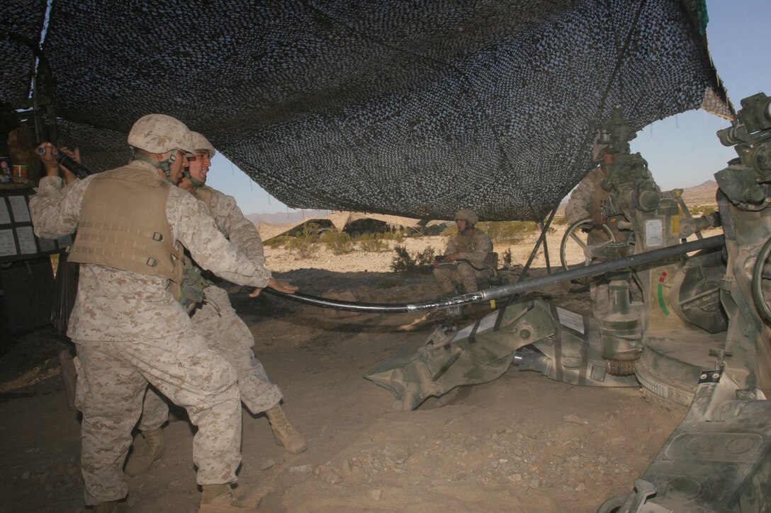 CAMP PENDLETON, Calif. (Sept. 16, 2005) - Navy Petty Officer 1st Class Jesse G. Arzate, a hospital corpsman with the 15th Marine Expeditionary Unit, shows a picture of a human head after it was struck by a bullet. Arzate taught more than 30 Marines during a scheduled medical brief about combat injuries, Sexually Transmitted Diseases, and field sanitation.