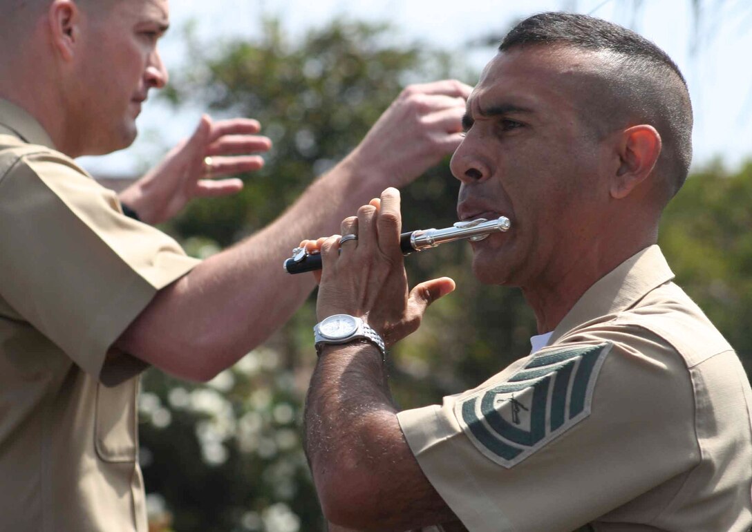 Gunnery Sgt. Eduardo Munoz, a flute player with the 1st Marine Division Band, performs during Oceanside's 25th Annual Harbor Days celebration.