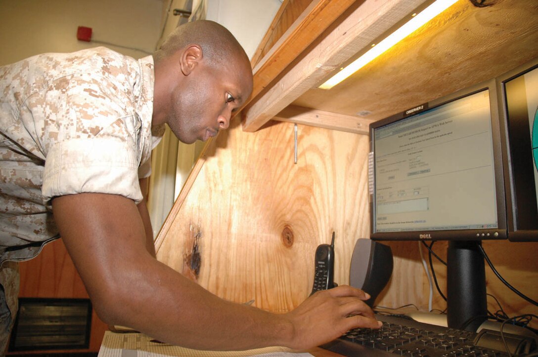 Sgt. Jarvis L. White, Headquarters and Headquarters Squadron weather observer and native of Tampa, Fla., inputs the hourly weather readings into a computer Sept. 23 at Station Meteorological Oceanographic Command. These readings are displayed on the station?s Commander?s Access Channel, channel 76, and used by different weather services to compile forecasts.