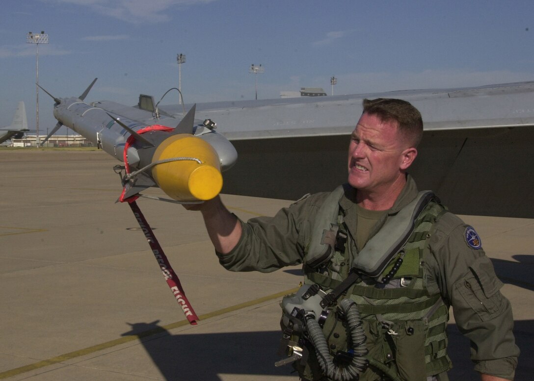 Lt. Col. Bill "Rock" Collins, commanding officer, Marine Fighter Attack Squadron 112, checks a AIM-9X "Sidewinder" Missile during his pre-flight inspection before departing for England and Exercise Urgent Quest from Naval Air Station-Joint Reserve Base Fort Worth, Texas on Sept. 18, 2005.