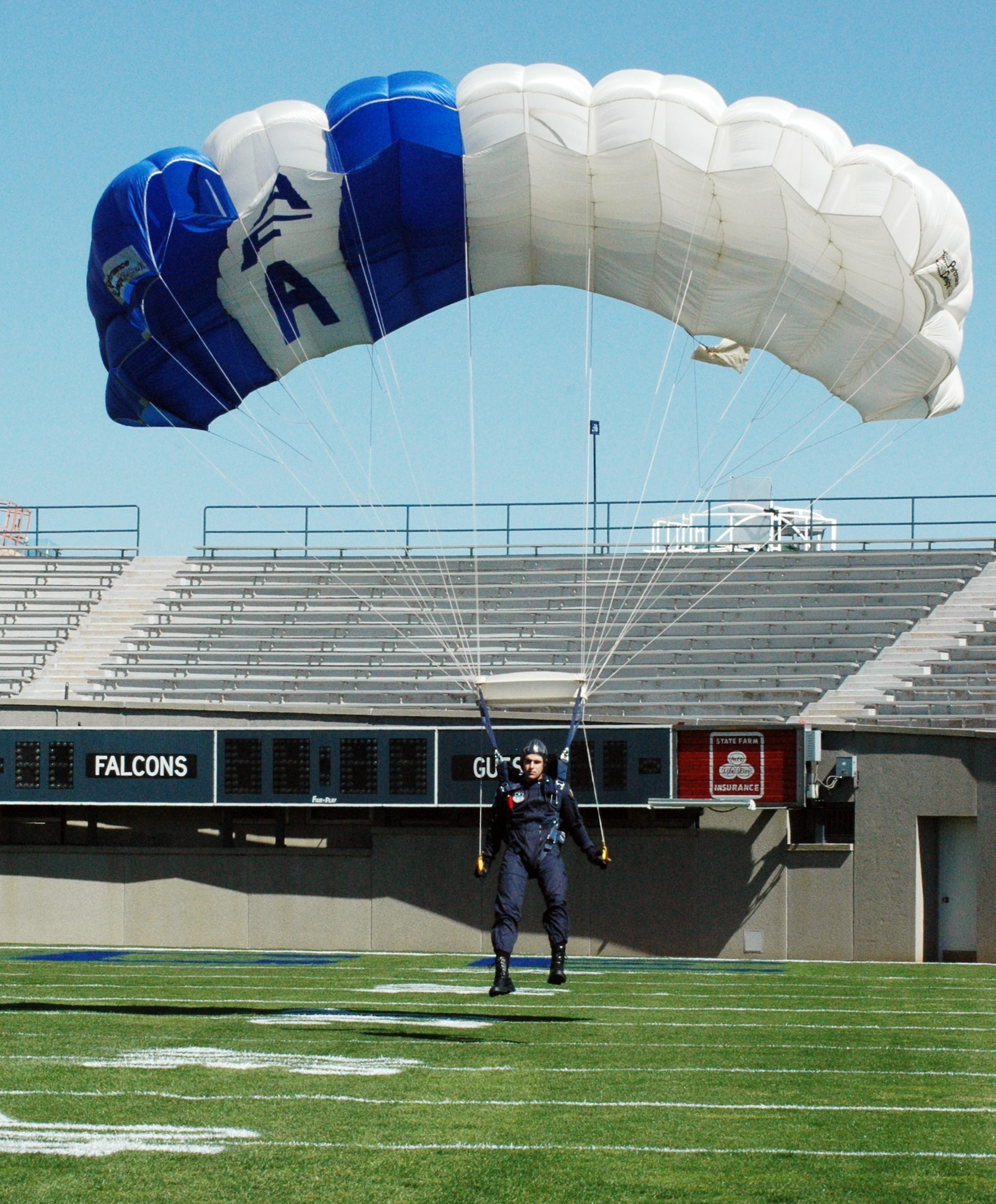 U.S. AIR FORCE ACADEMY, Colo. -- Cadet 1st Class Tom Sacchieri prepares for a soft landing on the 20-yard line during a "Wings of Blue" practice jump.  The academy's parachute demonstration team gets the opportunity to perform at events such as academy football games.  (U.S. Air Force photo by Tech. Sgt. Matt Gilreath)