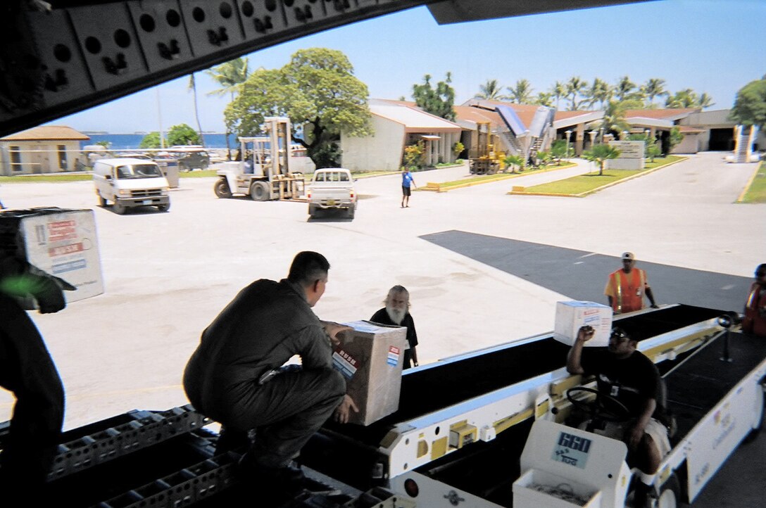 MAJURO, Marshall Islands -- Airmen deliver emergency lifesaving medicine and supplies to the Marshall Islands airport after the city's hospital was decimated by fire.  All patients had to be evacuated, and the Air Force special delivery allowed doctors to continue treating them.  (U.S. Air Force photo)
