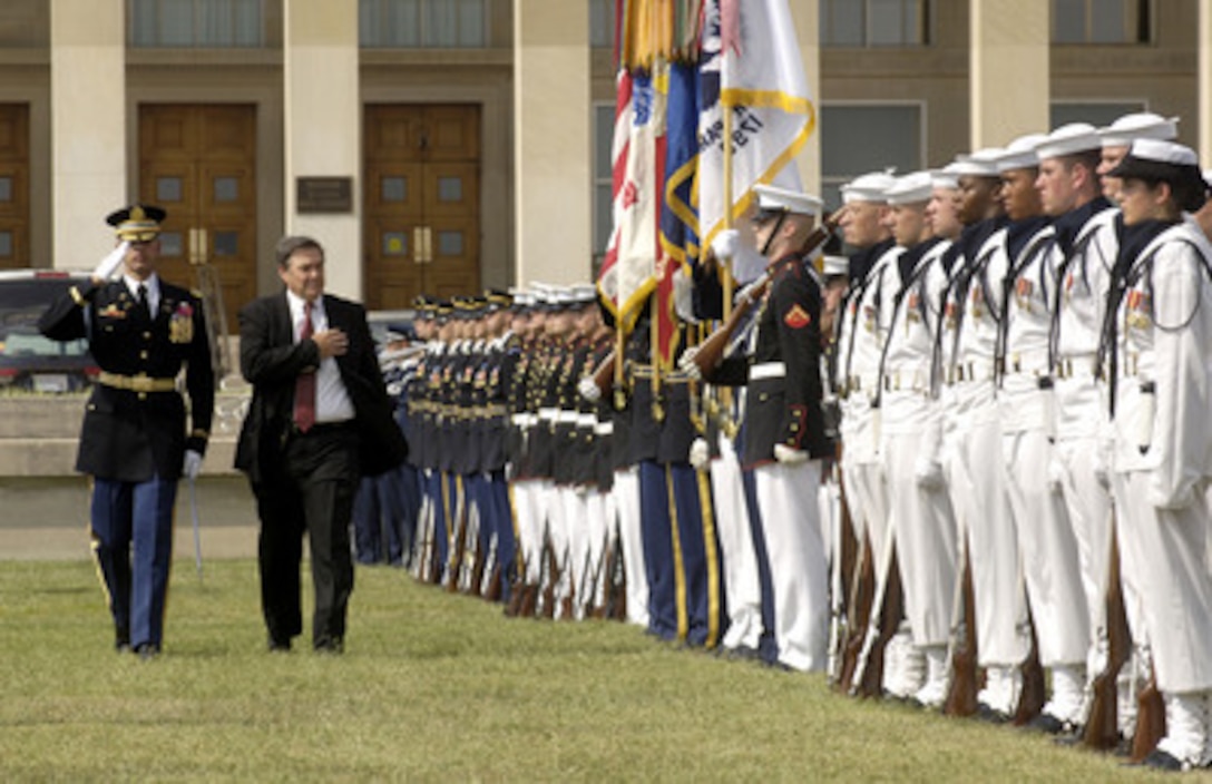 Rep. Duncan Hunter, chairman of the House Armed Services Committee, is escorted by Commander of Troops Col. Robert Pricone, U.S. Army, as he inspects the joint services honor guard at the Pentagon during the National POW/MIA Recognition Day ceremony on Sept. 16, 2005. Hunter, a Vietnam veteran, was the guest speaker for the event co-hosted by Acting Deputy Secretary of Defense Gordon England and Chairman of the Joint Chiefs of Staff Gen. Richard B. Myers, U.S. Air Force. The ceremony was attended by many veterans of earlier wars and by representatives of all the nation's veteran service organizations. 