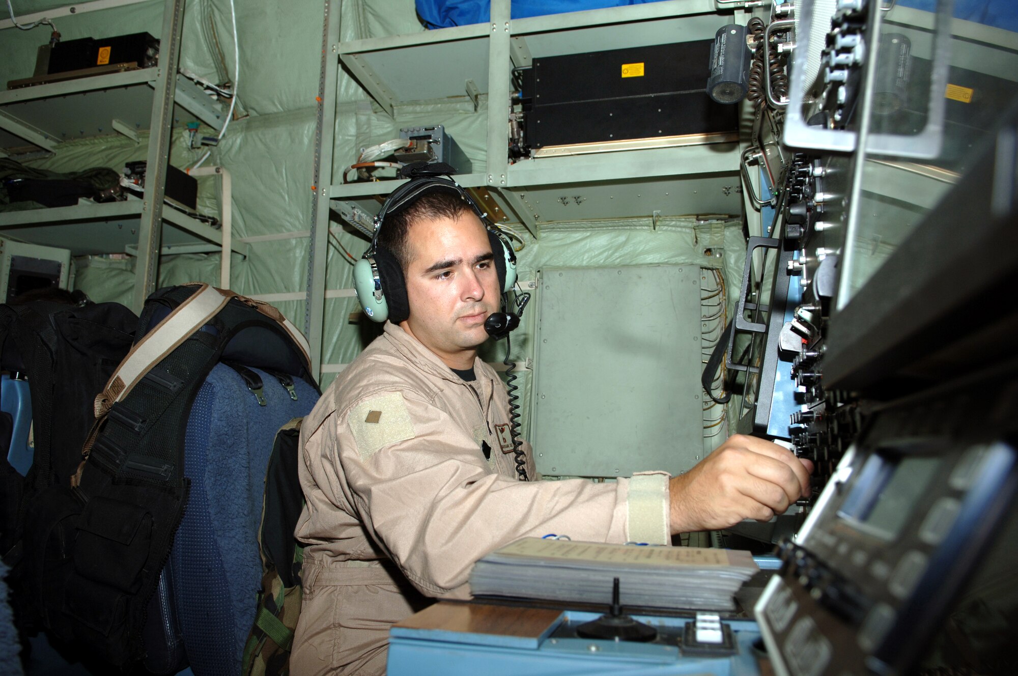 BAGRAM AIR BASE, Afghanistan -- Tech. Sgt. David Ortegon conducts preflight checks on an EC-130H Compass Call aircraft before takeoff here to support Afghanistan's National Assembly elections Sept. 18.  The aircraft, along with A-10 Thunderbolt IIs and U.S. Navy EA-6B Prowlers, have stepped up efforts throughout Afghanistan to deter enemy aggression and help ensure voter safety.  Sergeant Ortegon is deployed from Davis-Monthan Air Force Base, Ariz.  (U.S. Air Force photo by Capt. James H. Cunningham)