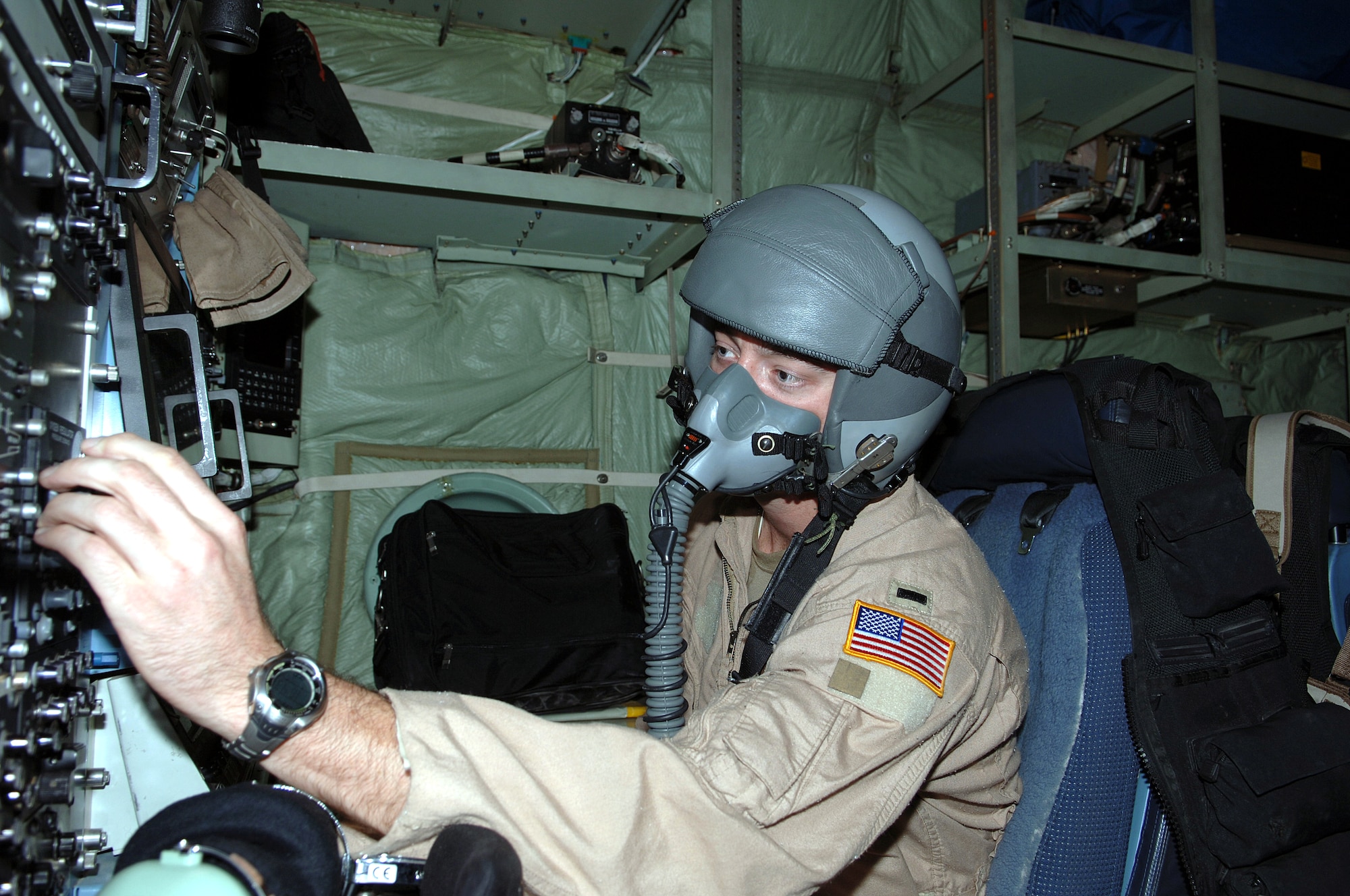 BAGRAM AIR BASE, Afghanistan -- First Lt. Jeremy Smith conducts preflight checks on an EC-130H Compass Call aircraft before takeoff here to support Afghanistan's National Assembly elections Sept. 18.  The aircraft, along with A-10 Thunderbolt IIs and U.S. Navy EA-6B Prowlers, have stepped up efforts throughout Afghanistan to deter enemy aggression and help ensure voter safety.  Lieutenant Smith is deployed from Davis-Monthan Air Force Base, Ariz.  (U.S. Air Force photo by Capt. James H. Cunningham)