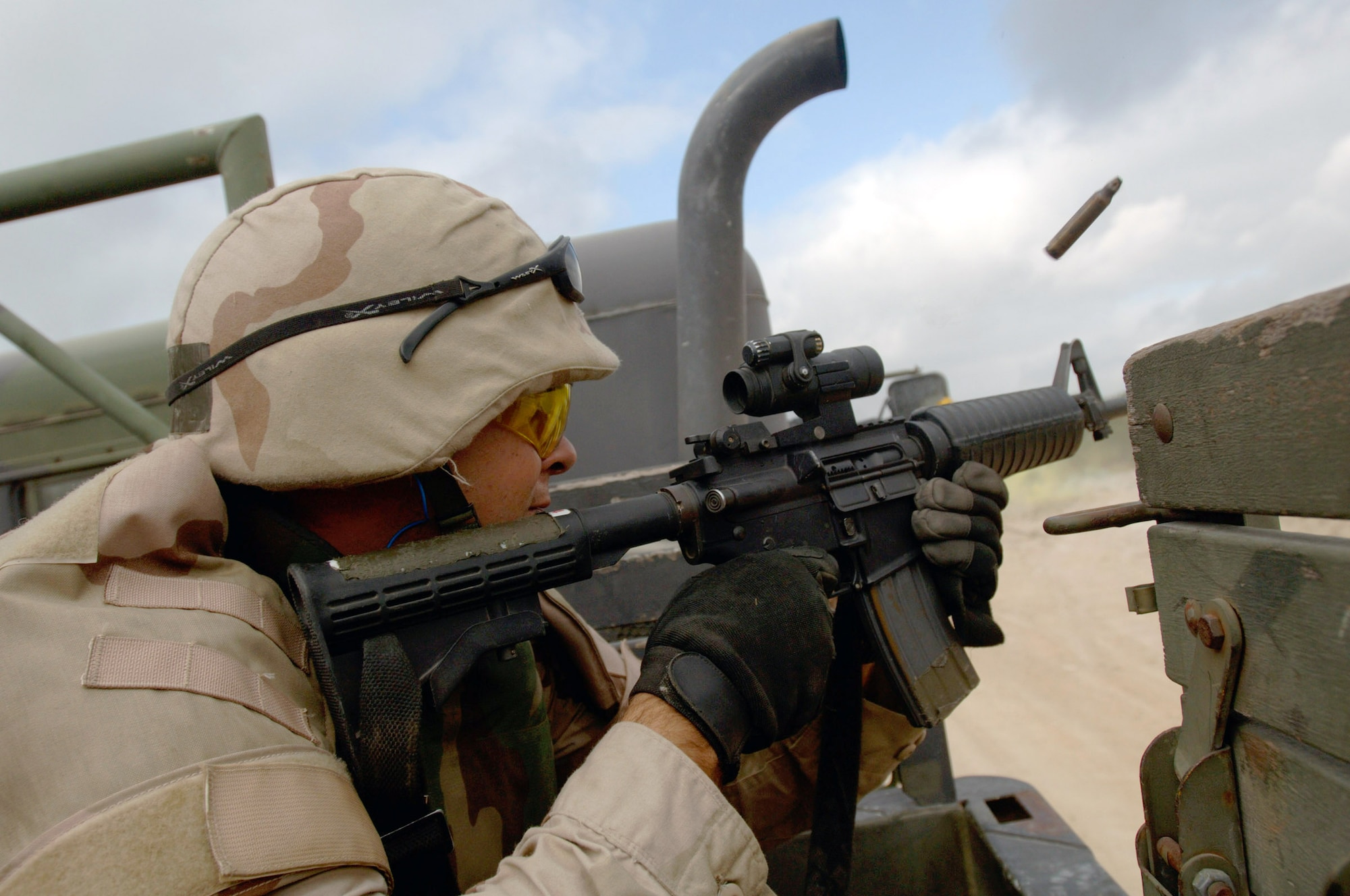 SAN ANTONIO -- Staff Sgt. Brian Hanson scans and shoots out the right side of a 2 1/2-ton truck during a basic combat convoy course on-road training scenario.  The course is designed to train transportation Airmen in basic combat skills required to integrate with joint forces in hostile convoy operations.  The mentally and physically challenging course is conducted at nearby Camp Bullis and is run by the 37th Training Wing at Lackland Air Force Base.  Sergeant Hanson is assigned to the 16th Logistics Readiness Squadron at Hurlburt Field, Fla.  (U.S. Air Force photo by Master Sgt. Lance Cheung) 