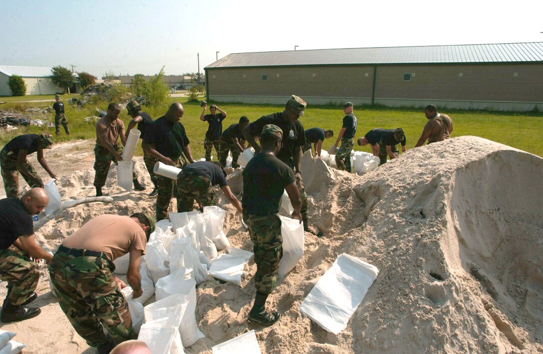 ELLINGTON FIELD, Texas -- Airmen with the 147th Fighter Wing here fill sandbags Sept. 21 to protect buildings from flooding that Hurricane Rita is projected to bring.  Rita is the third worst hurricane in recorded history and is expected to make landfall Sept. 24.  Ellington Field is 17 miles southeast of Houston.  (U.S. Air Force photo by Senior Airman Christopher D. Kerens)