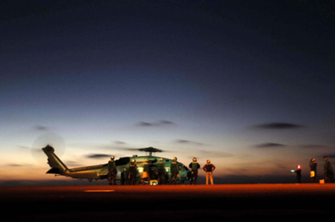An SH-60B Seahawk helicopter assigned to Helicopter Anti-Submarine Squadron Light 47 refuels during plane guard duties aboard the aircraft carrier USS Abraham Lincoln (CVN 72) on Sept. 19, 2005. The Lincoln and embarked Carrier Air Wing 2 are conducting training off the coast of Southern California. 