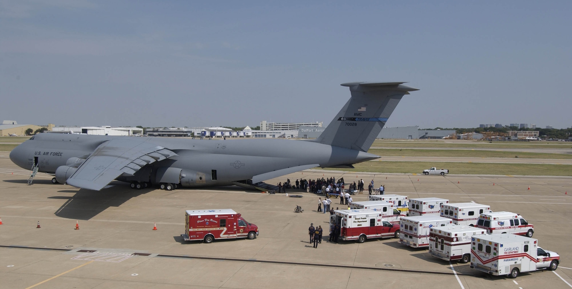 DALLAS -- Hospital patients from Beaumont, Texas, are taken off a C-5 Galaxy Sept. 23 en route to one of the many medical facilities set up to care for evacuees from the path of Hurricane Rita.  The aircraft is from the from the 21st Airlift Squadron, Travis Air Force Base, Calif.  The U.S. Air Force is contributing to the Hurricane Rita humanitarian assistance operations being led by the Federal Emergency Management Agency in conjunction with the Department of Defense. (U.S. Air Force photo by Tech. Sgt. Jennifer C. Wallis)