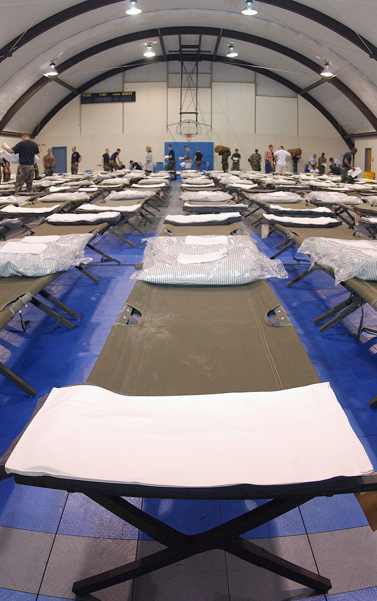 ABILENE, Texas -- About 100 Airmen from Dyess Air Force Base, Texas, volunteered at three shelters here to set up cots for more than 450 evacuees seeking refuge from Hurricane Rita. (U.S. Air Force photo by Airman 1st Class Chris Walkenhorst)               