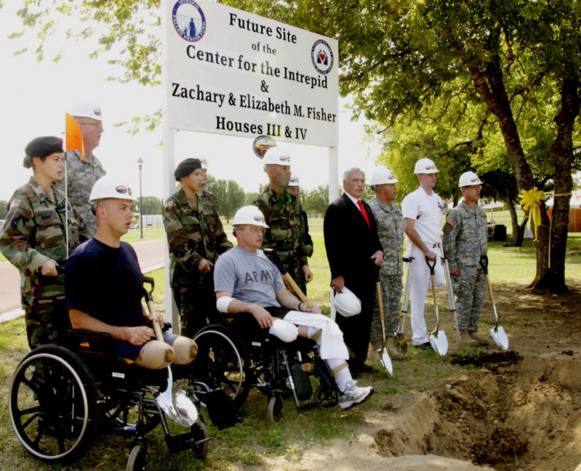 FORT SAM HOUSTON, Texas -- Wounded warriors recovering at Brooke Army Medical Center here including (from left to right) Spc. Andy Soules, Army Master Sgt. Tom Carpenter, Sgt. Juan Arredondo and Navy hospital corpsman Derek McGinnis join the official party at the Sept. 22 groundbreaking for the new National Armed Forces Physical and Rehabilitation Center being built here.  (U.S. Army photo by Darren Reehl)