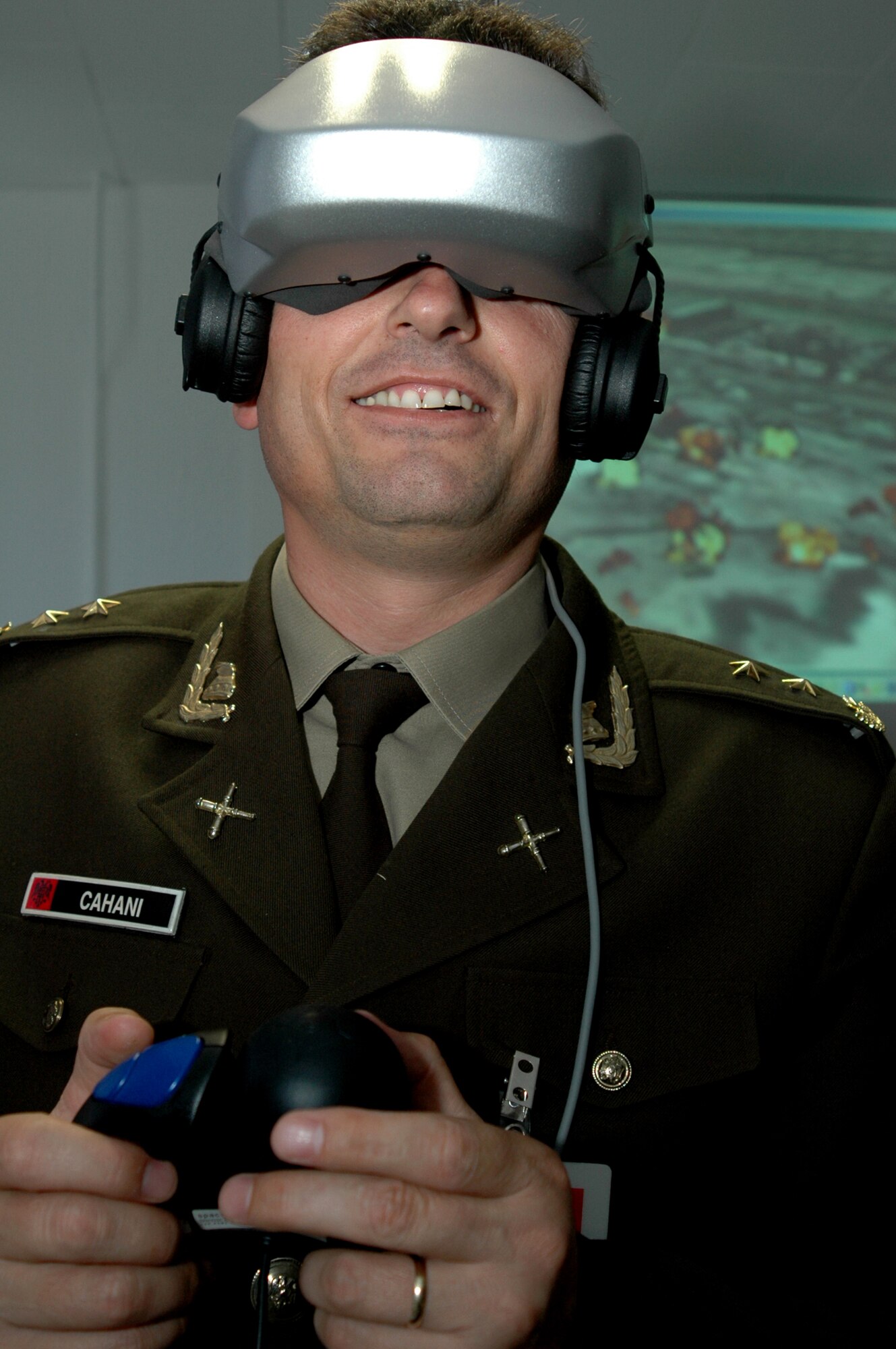 RAMSTEIN AIR BASE, Germany -- Albanian Lt. Col. Nazmi Cahani controls the point-of-view through a head-mounted virtual reality display as part of an opposing force demonstration at the Warrior Preparation Center here Sept. 22.  Nine Albanian and Slovakian officers toured the center for a familiarization visit Sept. 20 to 23. (U.S. Air Force photo by Capt. Jonathan Friedman)