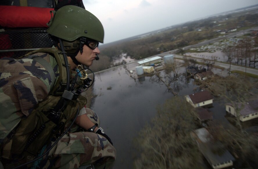 RANDOLPH AIR FORCE BASE, Texas -- Senior Airman Arthur Zingler, an HH-60 Pave Hawk pararescueman, searches for Hurricane Rita victims during night operations over southern Louisiana. The Airman deployed here with the 38th Rescue Squadron from Moody Air Force Base, Ga. The unit has been doing search and rescue missions over the Rita affected are since arriving Sept. 24. (U.S. Air Force photo by Tech. Sgt. Rob Jensen)