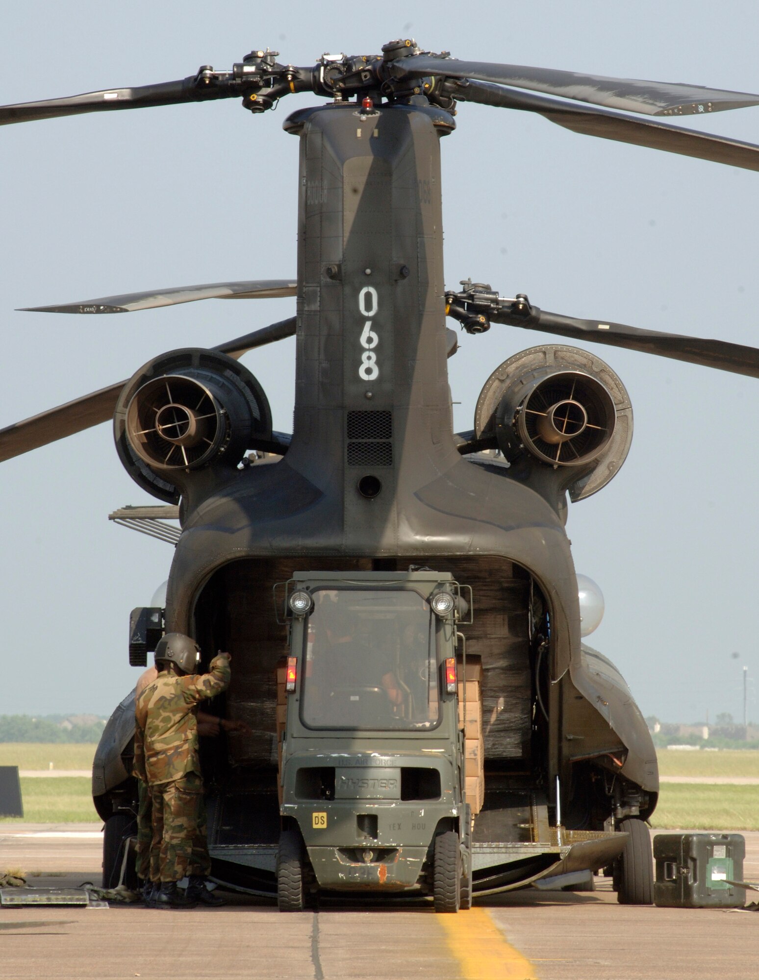 ELLINGTON FIELD, Texas -- An Army CH-47 Chinook helicopter is loaded with food and water here Sept. 25 for delivery to Hawthorn, Texas. Aircraft activity increased here where relief efforts are underway to support areas affected by Hurricane Rita. (U.S. Air Force photo by Master Sgt. Lance Cheung)
