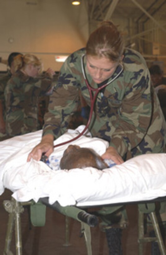 A U.S. Air Force nurse with the 133rd Air National Guard measures the vital signs of a patient being evacuated from a Houston, Texas, area hospital before Hurricane Rita heads inland on Sept. 23, 2005. The patients were flown to Will Rogers Air National Guard Base in Oklahoma City, Okla. Department of Defense units are mobilized as part of Joint Task Force Rita to support the Federal Emergency Management Agency's disaster-relief efforts in the Gulf Coast areas devastated by Hurricane Rita. 