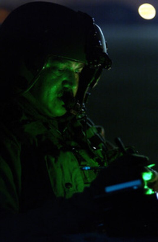 U.S. Army Sgt. Tom Rios conducts post flight checks on a UH-60A Black Hawk helicopter at Ellington Field, Texas, on Sept. 25, 2005. Rios is a crew chief assigned to the 149th Air Ambulance, Martindale Army Air Field, San Antonio, Texas, in the area to assist in Hurricane Rita relief efforts. 