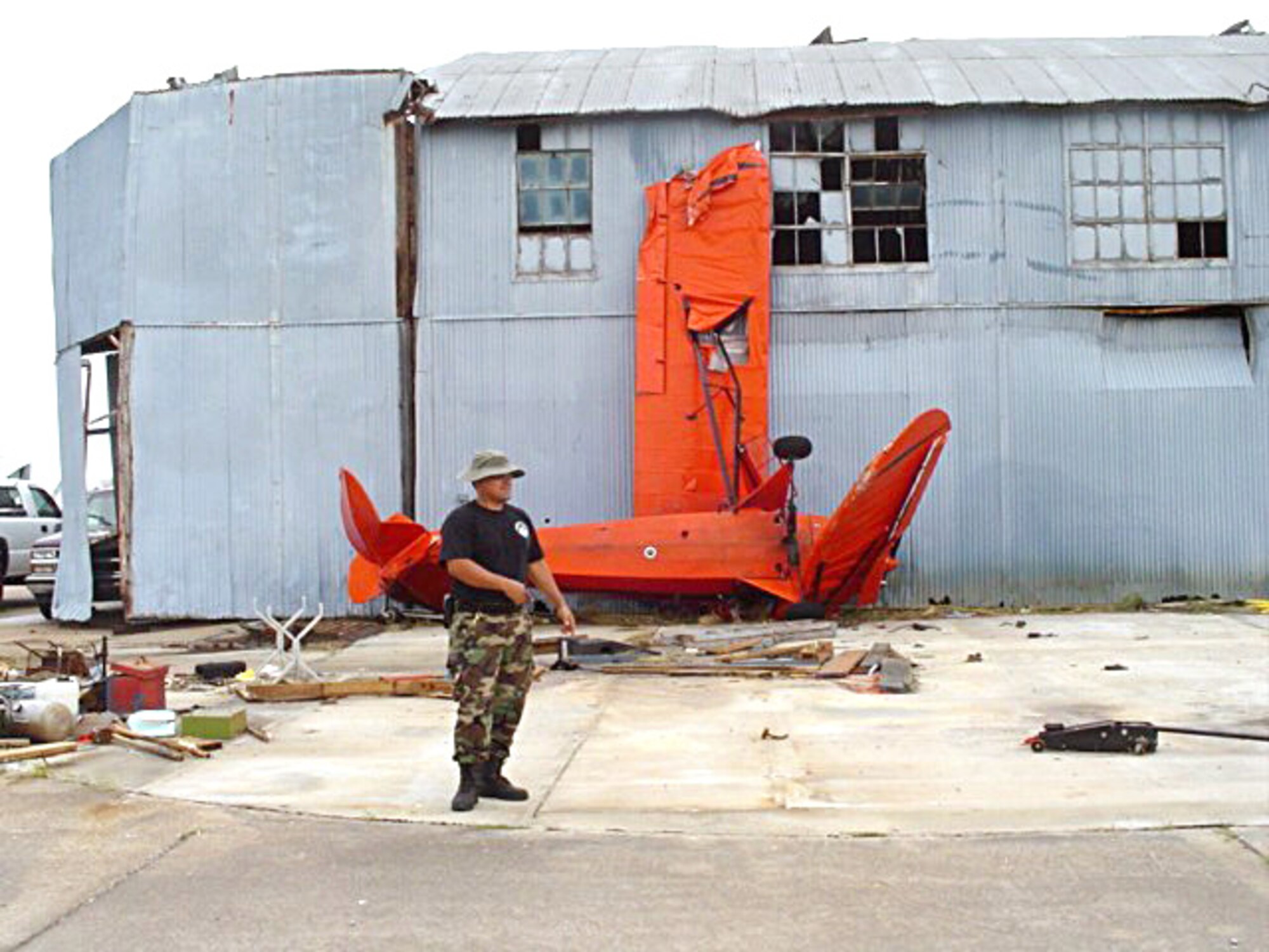 NEDERLAND, Texas -- Staff Sgt. Al Martinez surveys damage caused by Hurricane Rita to the Southeast Texas Regional Airport. When he arrived, the airport was inoperable, but the civil engineer soon had power up and running. (U.S. Air Force photo by Claudette Manning) 