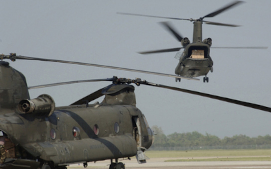 A U.S. Army CH-47 Chinook helicopter takes off from Ellington Field, Texas, to deliver food and water to Texas Gulf Coast residents affected by Hurricane Rita on Sept 25, 2005. Department of Defense units are mobilized as part of Joint Task Force Rita to support the Federal Emergency Management Agency's disaster-relief efforts in the Gulf Coast areas devastated by Hurricane Rita. 