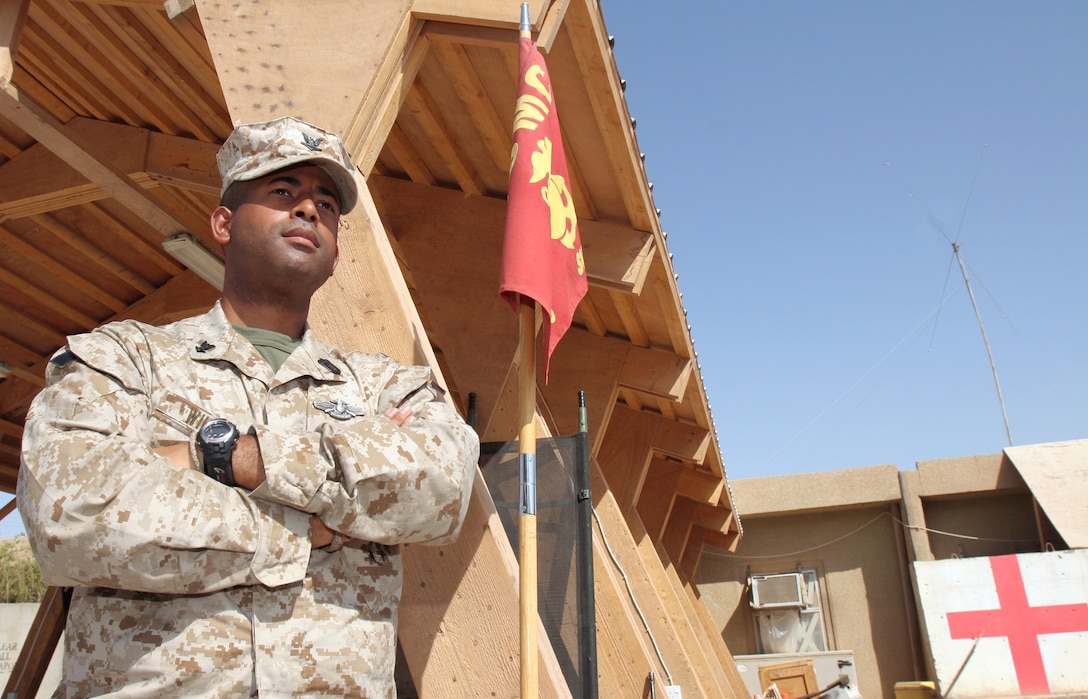 Lance Cpl. Justin Snyder, a 1/3 Charlie Company fire team leader from Las Vegas, who was awarded the Purle Heart for wounds he sustained in Fallujah, Iraq, poses with an M203 grenade launcher attached to his M16-A2 service rifle.  In the bakcground stand the makeshift barracks 1/3 is using during their deployment to Camp Wilson, Marine Corps Air Ground Combat Center, Twentynine Palms, Calif., for a Combined Arms Exercise (CAX).