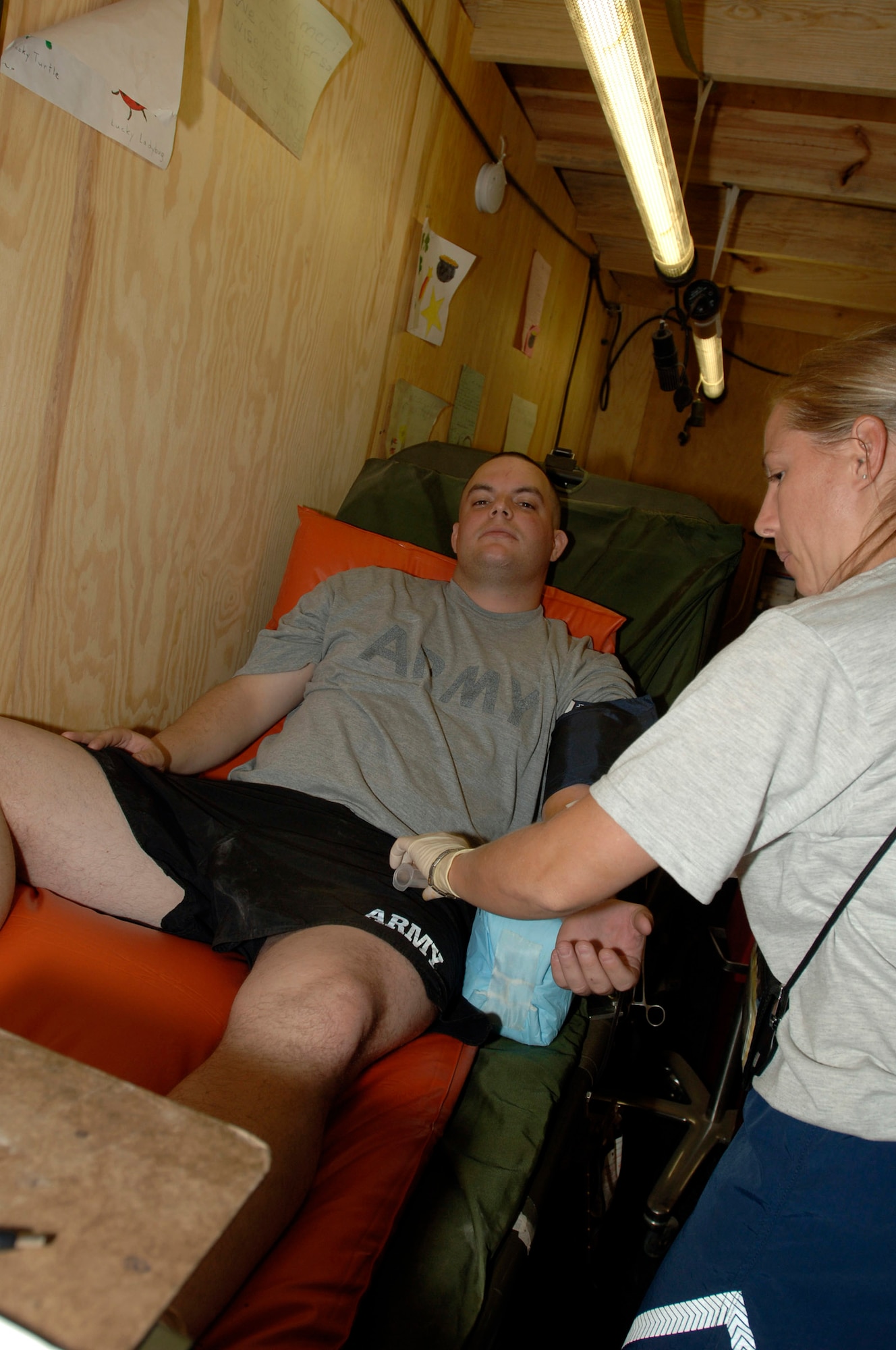 BALAD Air Base, Iraq -- An U.S. Soldier donates blood here on Sept. 29 to help Iraqi citizens caught in the car bomb blasts that day in the town of Balad. (U.S. Air Force photo by Staff Sgt. Shannon Kluge)
