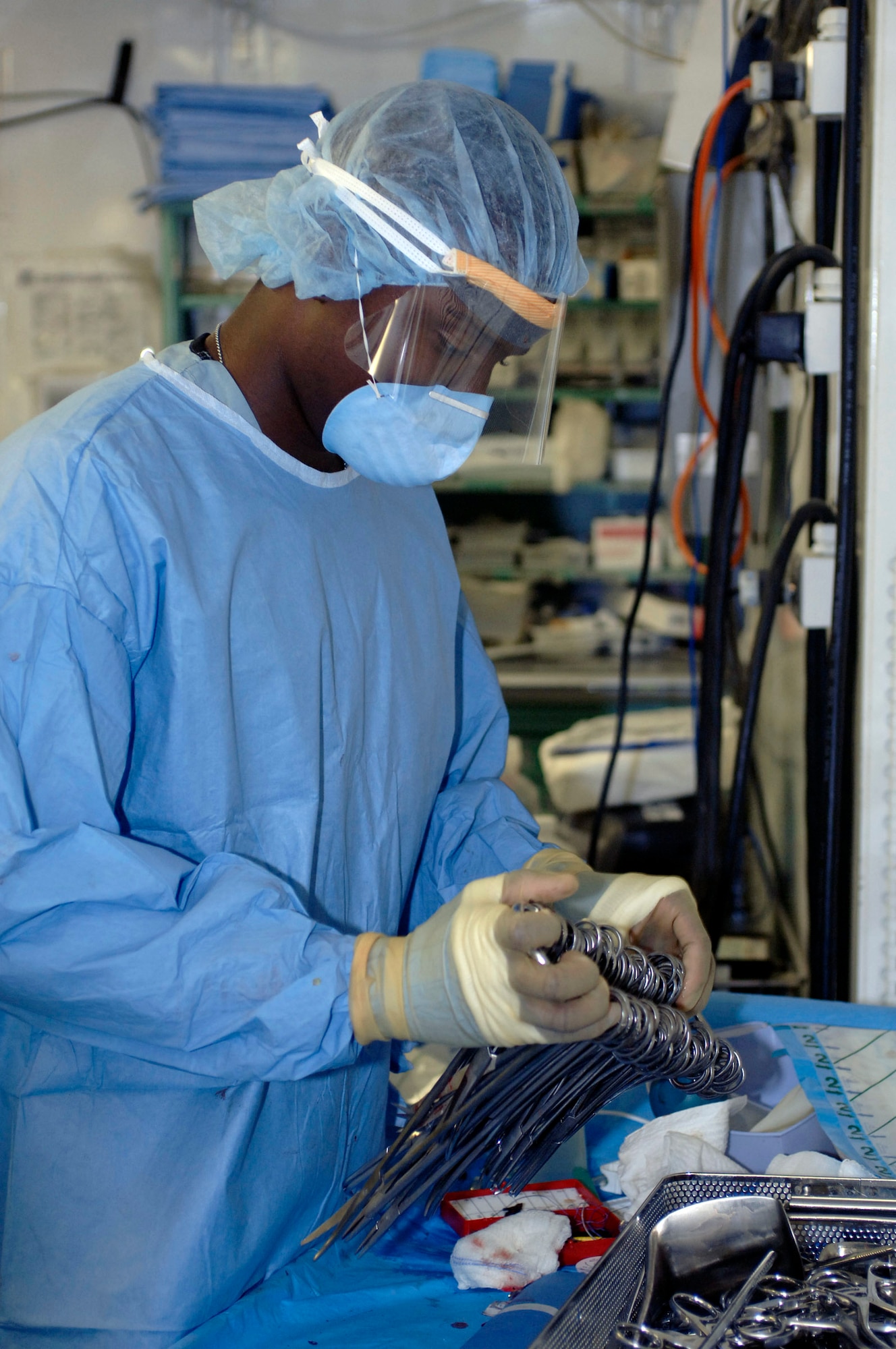 BALAD AIR BASE, Iraq -- An Air Force surgeon preps equipment for emergency surgery on Iraqis caught in the car bomb blasts that occurred Sept. 29 in the town of Balad. Victims of the attack were rushed here to the Air Force Theater Hospital. (U.S. Air Force photo by Staff Sgt. Shannon Kluge)
