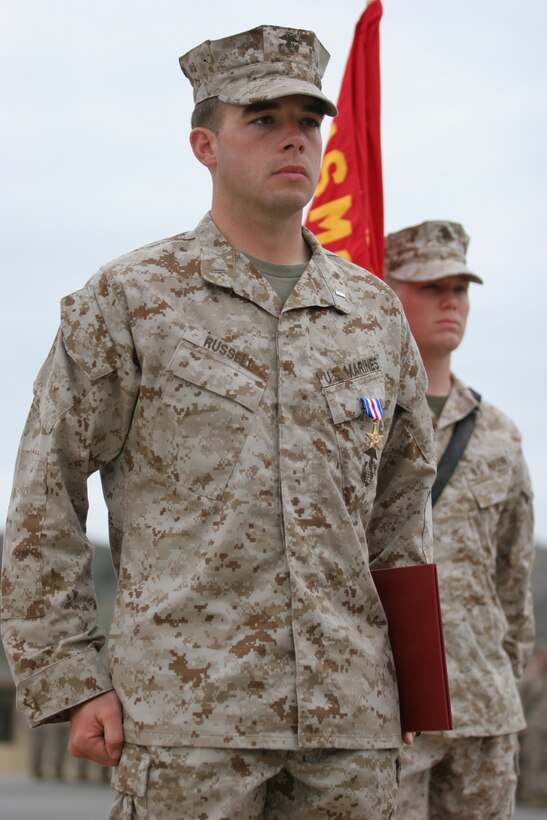 060331-M-7082F-001 CAMP PENDLETON, Calif. -- 1st Lt. David Russel was awarded the Silver Star medal by Maj. Gen. Richard F. Natonski in a ceremony here March 31. Russel earned the Silver Star for his actions on May 3, 2005 at Al Ramadi. Russel is a 25-year-old from Georgetown, Tx. and a platoon commander with Weapons Company, 1st Battalion, 5th Marine Regiment, 1st Marine Division. Natonski is the commanding general of the 1st Marine Division. (Official U.S. Marine Corps photo by Lance Cpl. Patrick J. Floto)(released)