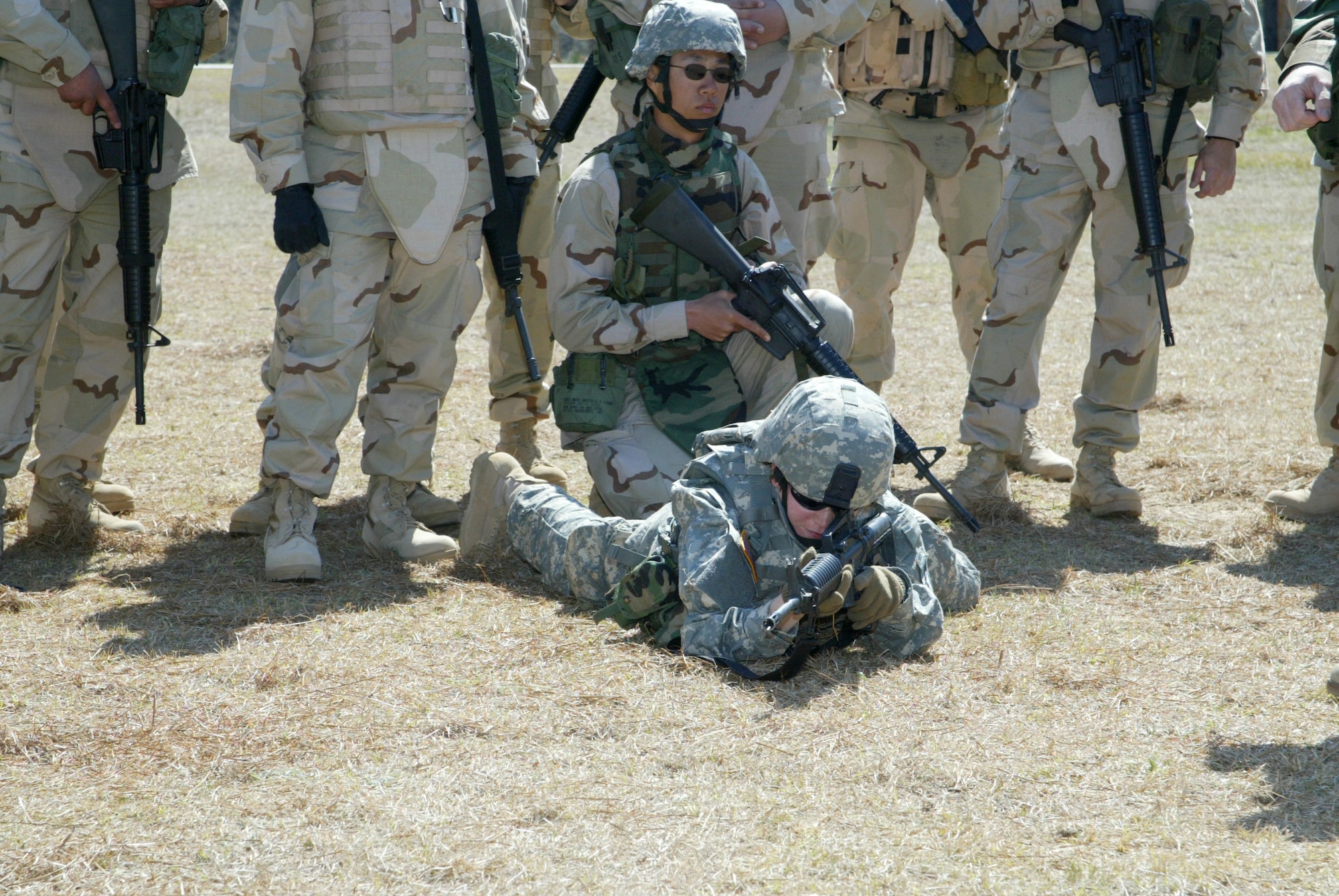 Army Spec. Danielle Bayar demonstrates a high crawl at a training site on Fort Bragg, N.C. (U.S. Air Force photo/Senior Airman Cassandra Locke) 

