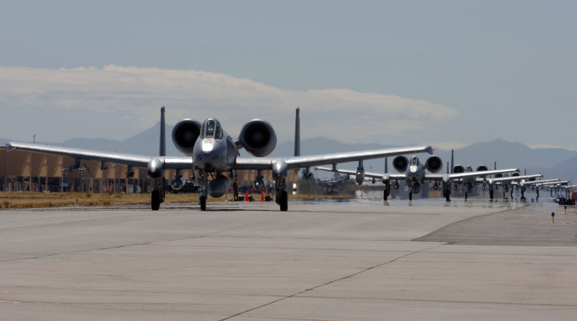 A-10 Thunderbolt IIs line up for take-off as part of a simulated deployment at Davis-Monthan Air Force Base, Ariz., on Saturday, April 1, 2006.  (U.S. Air Force photo/Staff Sgt. Lanie McNeal)
 
