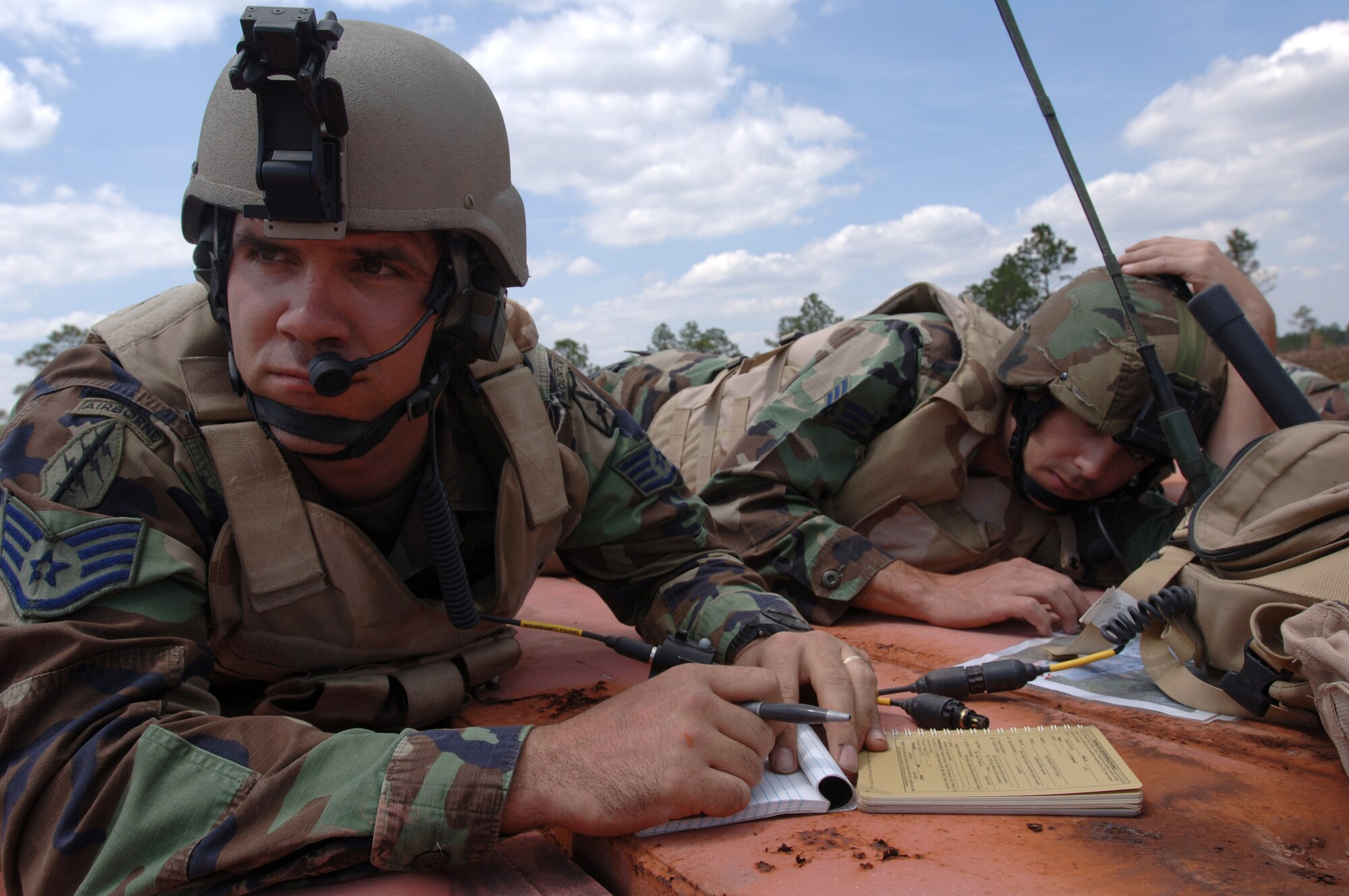 Staff Sgt. Brandon Peterson (left) and Senior Airman Robert Ellis, joint terminal attack controllers with the 21st Air Support Operation Squadron at Wheeler Army Air Field, Hawaii, coordinate air operations during Atlantic Strike III at Avon Park, Fla., on Thursday, March 30, 2006. (U.S. Air Force photo/Staff Sgt. Ashley S. Brokop)