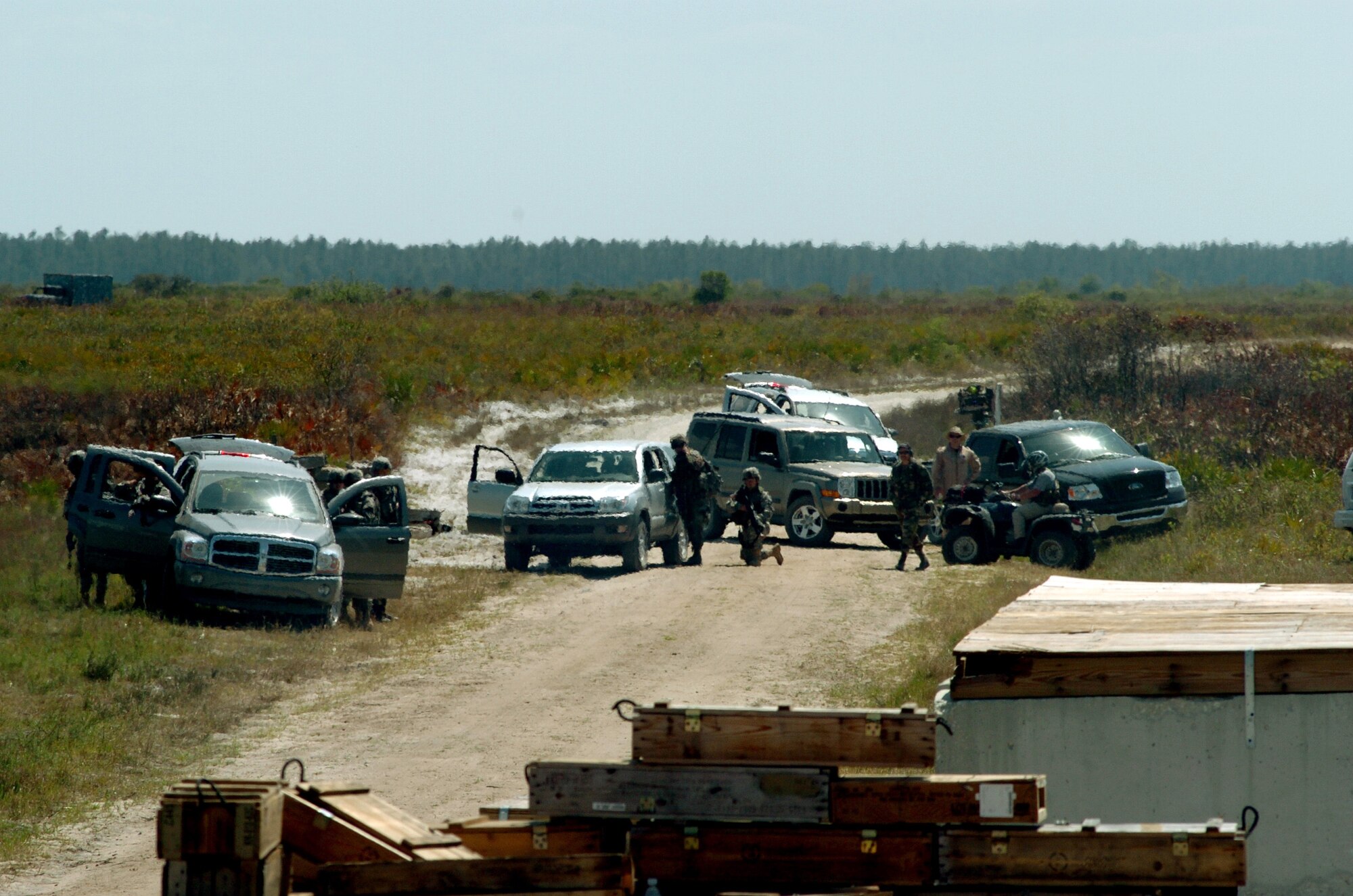 A 42-person scout team and convoy enter the mock village at Avon Park, Fla., during deployment preparation training on Wednesday, March 29, 2006. More than 250 servicemembers participated in Atlantic Strike III at Avon Park, Fla. March 29 to 30. (U.S. Air Force photo/Staff Sgt. Ashley S. Brokop)