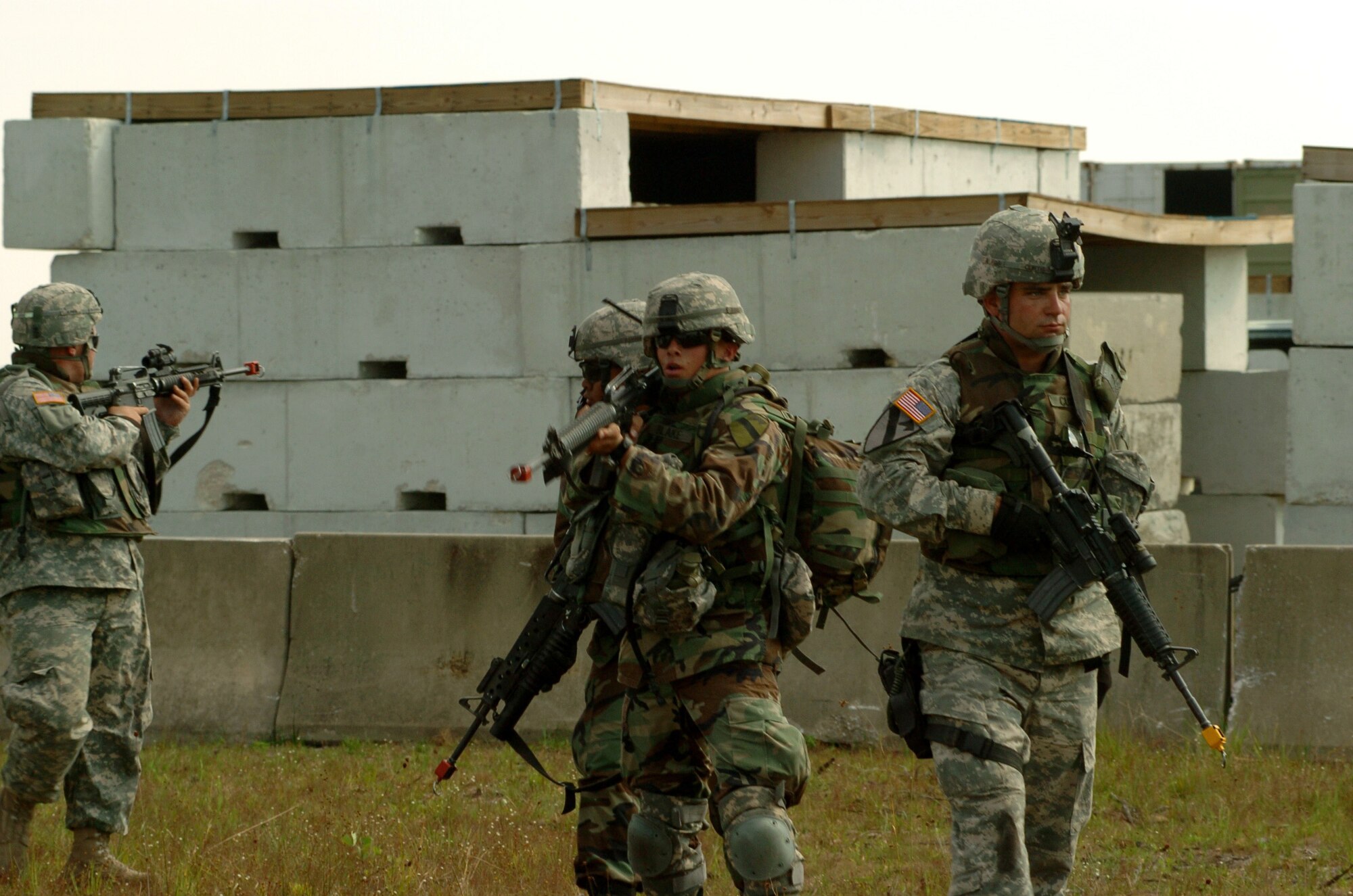 Members of a 42-person scout team from the 1st Cavalry Division at Fort Hood, Texas, clear the mock village at Avon Park, Fla., on Wednesday, March 29, 2006 as part of Atlantic Strike III, a joint air and ground training event. (U.S. Air Force photo/Staff Sgt. Ashley S. Brokop)
