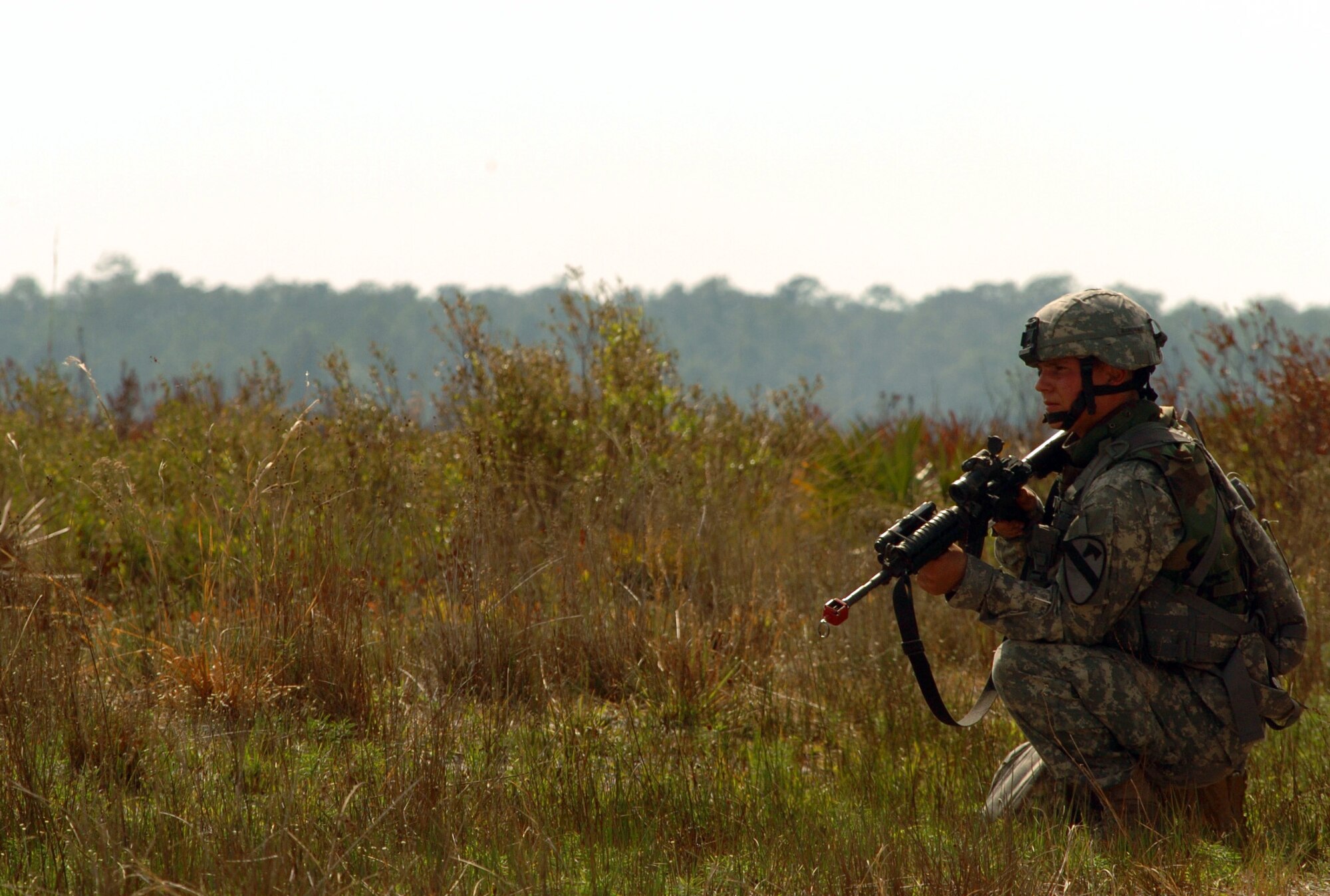 Pfc. Jeffrey Roman of the 1st Cavalry Division at Fort Hood, Texas, stands fast as snipers secure the area during training at Avon Park, Fla., on Wednesday, March 29, 2006, as part of Atlantic Strike III, a joint air and ground training event. (U.S. Air Force photo/Staff Sgt. Ashley S. Brokop)