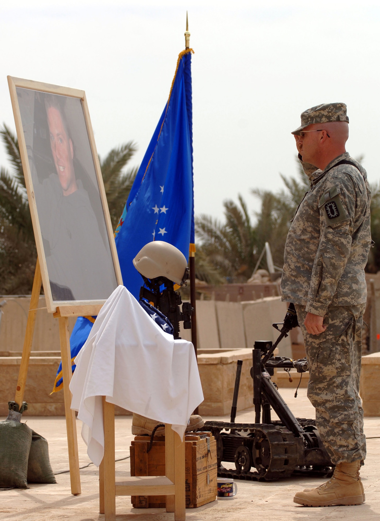 A Soldier renders a final salute in honor of Tech. Sgt. Walter Moss at a memorial service on Saturday, April 1, 2006, at Sather Air Base, Iraq. Sergeant Moss, a 447th Expeditionary Civil Engineer Squadron explosive ordnance disposal flight technician, was killed in an explosion while performing safing operations near Baghdad March 29. He was the first Airman from Sather AB to be killed in action during Operation Iraqi Freedom. (U.S. Air Force photo/Master Sgt. Will Ackerman)