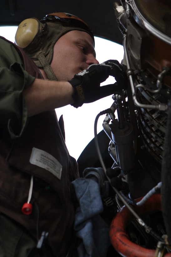 Staff Sgt. Leo Obernuefemann, Marine Medium Helicopter Squadron 365 (Reinforced) CH-53E Super Stallion flightline chief performs daily maintenance on an aircraft April 3, 2006.  HMM-365 (Rein.) is the Aviation Combat Element of the 24th Marine Expeditionary Unit and is participating in an Expeditionary Strike Group Exercise as part of its pre-deployment work-ups.