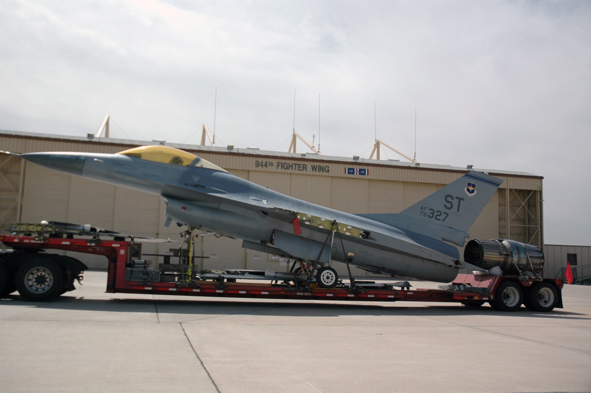 An F-16, tail number 79-0327, arrives at Luke Air Force Base April 4. The F-16 will become a static display in front of the 944th Fighter Wing headquarters painted in World War II Tuskegee colors complete with a red tail. The F-16 is scheduled to be unveiled as part of the annual Tuskegee Convention, which will be in Phoenix in August. The 301st and 302nd Fighter Squadrons of the 944th Fighter Wing trace their heritage to the Tuskegee Airmen. (U.S. Air Force Reserve photo by Staff Sgt. Susan Stout)