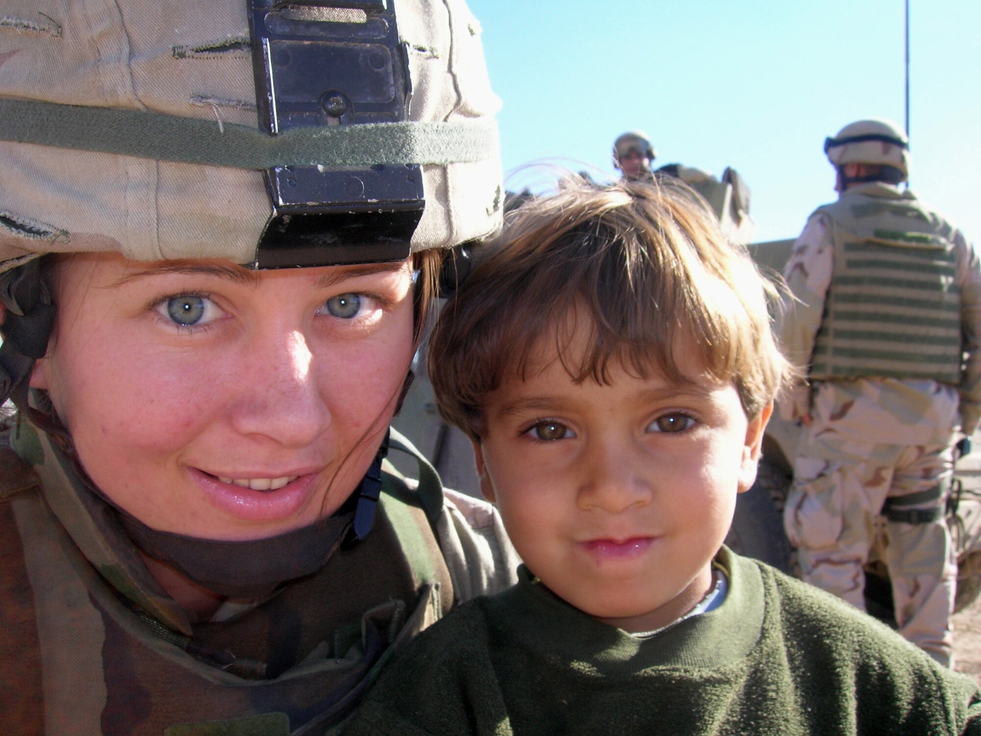 MOODY AIR FORCE BASE, Ga. - Senior Airman Polly-Jan Bobseine, 823rd Security Forces Squadron, is seen here with a friend she made while on patrol in villages around Kirkuk Air Base, Iraq. She recently won Air Combat Command’s Airman of the Year award. (Courtesy photo)