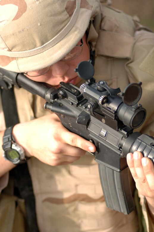 Senior Airman Christopher McDaniel secures an area while members of his element attempt to evacuate a simulated convoy casualty during the Basic Combat Convoy Training course at Camp Bullis, Texas, on Monday, April 3, 2006. The course is designed to keep Airmen battlefield focused and well-trained for convoy operations. (U.S. Air Force photo/Tech. Sgt. Cecilio Ricardo Jr.)