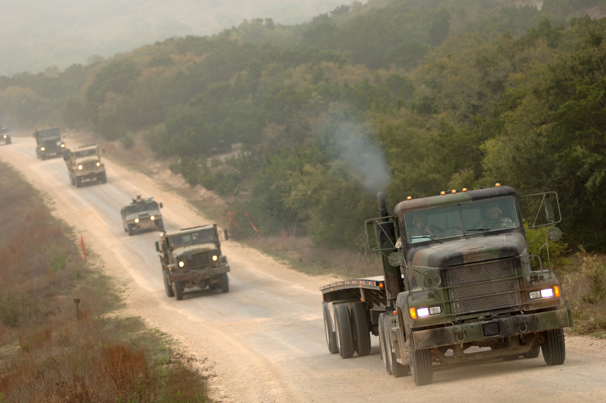 Airmen train in up-to-date convoy tactics and techniques in the Basic Combat Convoy Training course at Camp Bullis, Texas, on Monday, April 3, 2006. The course is designed to keep Airmen battlefield focused and well-trained for convoy operations.  (U.S. Air Force photo/Tech. Sgt. Cecilio Ricardo Jr.)  