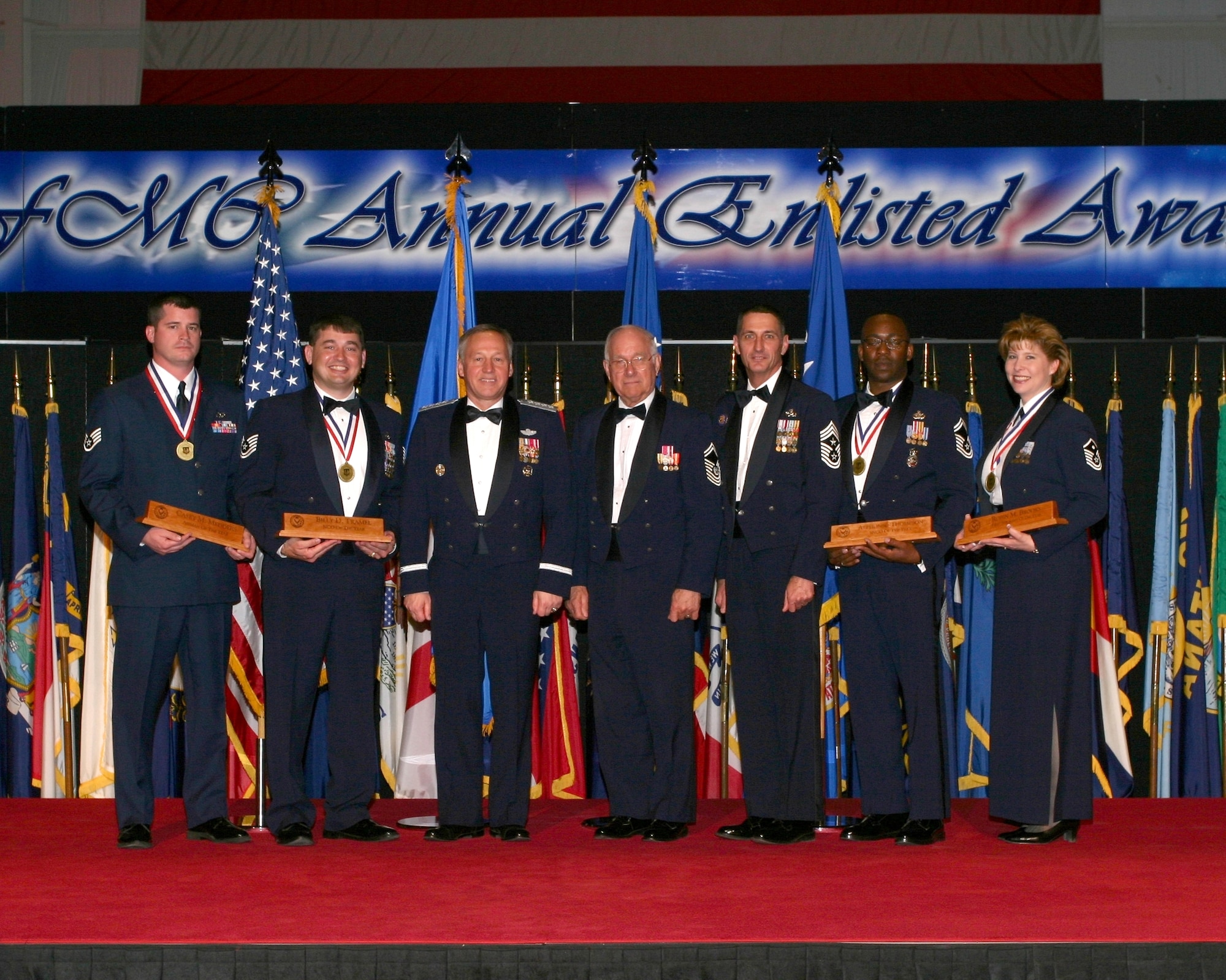 DAYTON, Ohio  - Air Force Materiel Command held its 2006 Annual Enlisted Awards Banquet at the National Museum of the U.S. Air Force on March 30. Posing with Commander Gen. Bruce Carlson, are: (left to right) Staff Sgt. Casey M. Medders, Airman of the Year; Technical Sgt. Billy D. Tramel Jr., Noncommissioned Officer of the Year; General Carlson; Chief Master Sergeant of the Air Force #8 Sam E. Parish; Chief Master Sgt. Jonathan E. Hake, command chief master sergeant for AFMC; Senior Master Sgt. Alphonso Thompson, Senior NCO of the Year, and Master Sgt. Robin M. Brooks, First Sergeant of the Year. (Air Force photo by Ben Strasser)

