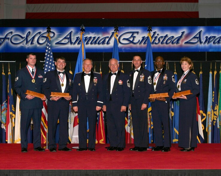 DAYTON, Ohio  - Air Force Materiel Command held its 2006 Annual Enlisted Awards Banquet at the National Museum of the U.S. Air Force on March 30. Posing with Commander Gen. Bruce Carlson, are: (left to right) Staff Sgt. Casey M. Medders, Airman of the Year; Technical Sgt. Billy D. Tramel Jr., Noncommissioned Officer of the Year; General Carlson; Chief Master Sergeant of the Air Force #8 Sam E. Parish; Chief Master Sgt. Jonathan E. Hake, command chief master sergeant for AFMC; Senior Master Sgt. Alphonso Thompson, Senior NCO of the Year, and Master Sgt. Robin M. Brooks, First Sergeant of the Year. (Air Force photo by Ben Strasser)

