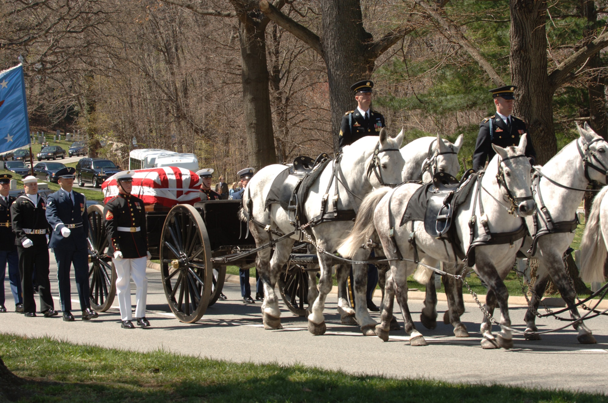 The casket containing former Secretary of Defense Caspar Weinberger arrives at the gravesite in Arlington National Cemetery, Arlington, Va., April 4, 2006.  Secetary Donald H. Rumsfeld delivered remarks during the memorial service.  (U.S. Air Force photo by Airman 1st Class Timothy S. Chacon)