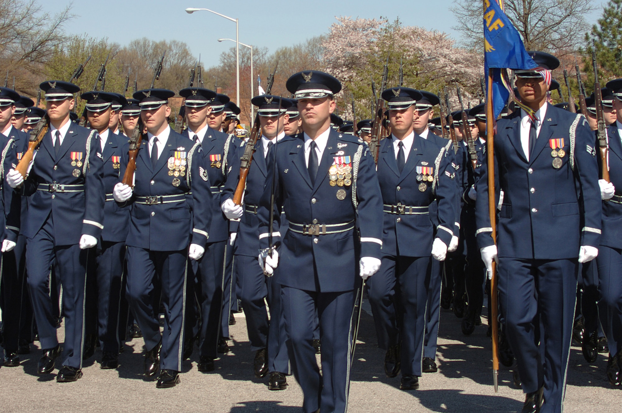 The U.S. Air Force Honor Guard escorts the casket containing former Secretary of Defense Caspar Weinberger from a memorial service in the Memorial Chapel to his final place of rest at Arlington National Cemetery, Arlington, Va., April 4, 2006.  Secetary Donald H. Rumsfeld delivered remarks during the memorial service.  (U.S. Air Force photo by Airman 1st Class Timothy S. Chacon)