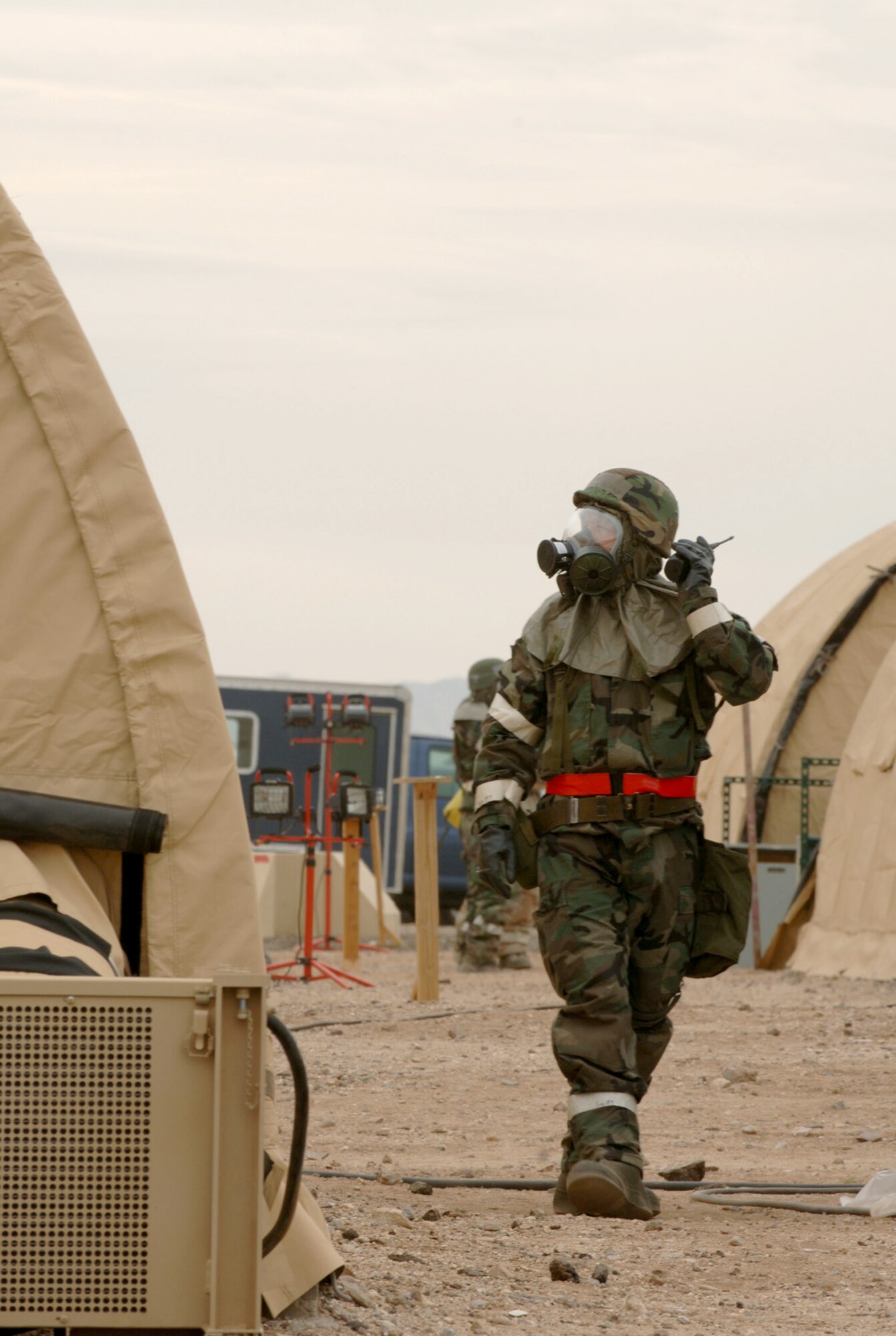 Tech. Sgt. Mark McKay checks the roof of a shelter during an exercise, in a simulated deployed location on Tuesday, April 4, 2006.  (U.S. Air Force photo/Staff Sgt. Lanie McNeal)