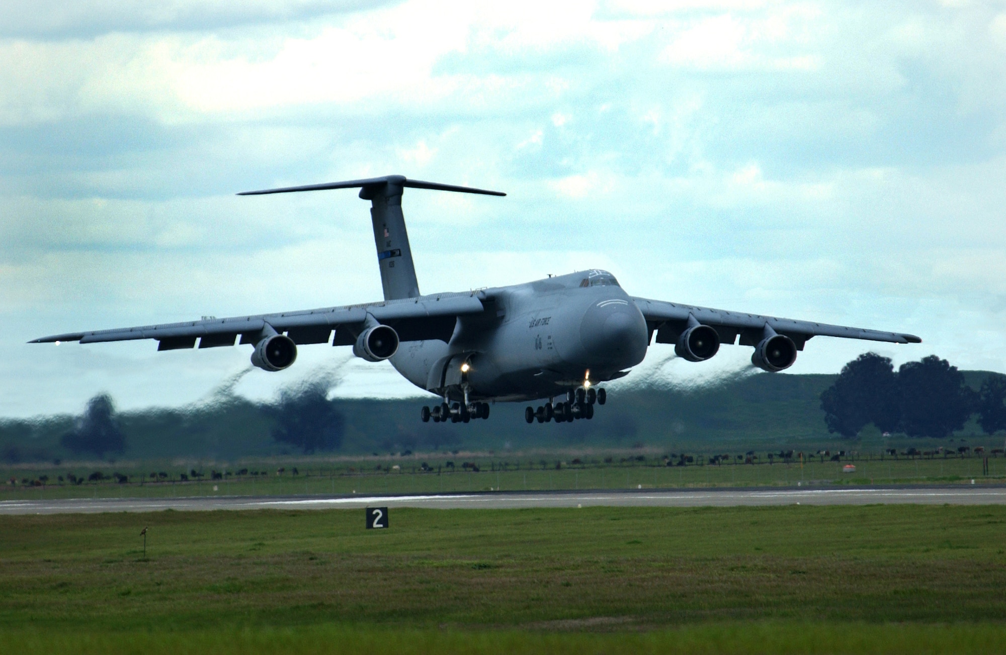 A Travis C-5 Galaxy returns from a training flight March 31. The event marked the final C-5 flight for the 21st Airlift Squadron. The squadron officially transitioned from a C-5 squadron to a C-17 squadron in a ceremony here April 3. The day also marked the squadron’s 64th anniversary. (U.S. Air Force photo by Nan Wylie)