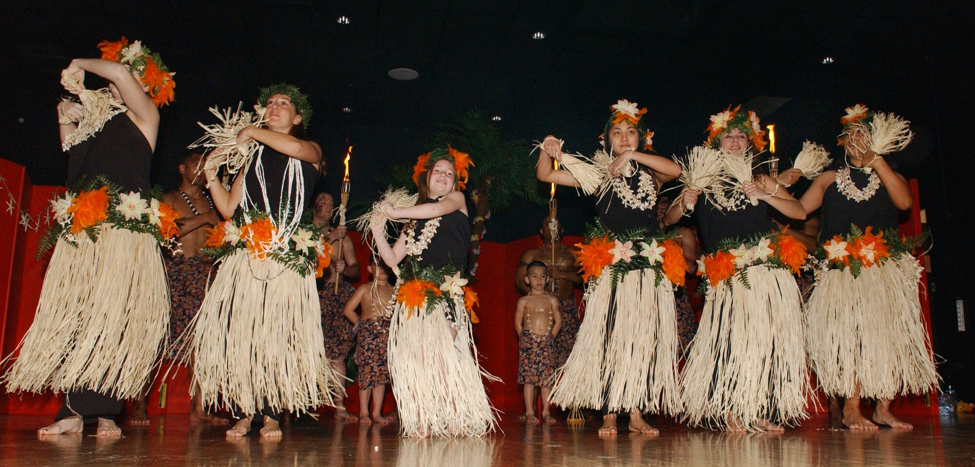The Wahine (ladies) Dancers, perform a dance called the Drums of Bora Bora. It is a Tahitian style dance that is known for it’s fast hip movements with the grass skirts. The dancers from left to right are Andrea Hayes, Tech. Sgt. Graciela Martinez (instructor), Cara Lenzi, Airman Mariko Cepeda, Tech. Sgt. Sandra Nunes and Staff Sgt. Mona Lisa Palone. (Photos by Airman 1st Class Tabitha Larson)  