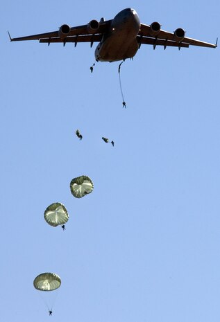 Soldiers from the 82nd Airborne Division jump from a C-17 Globemaster over a Fort Bragg, N.C., landing zone Wednesday, April 5, 2006.  The C-17 is from Charleston Air Force Base, S.C.  (U.S. Air Force photo/Master Sgt. Jack Braden)