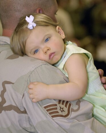 Staff Sgt. Ryan Hall holds his daughter on Monday, April 3, 2006, after returning to Charleston Air Force Base, S.C., from a six-month deployment to Camp Bucca, Iraq. Sergeant Hall is with the 437th Security Forces Squadron. (U.S. Air Force photo/Airman 1st Class Nicholas Pilch) 