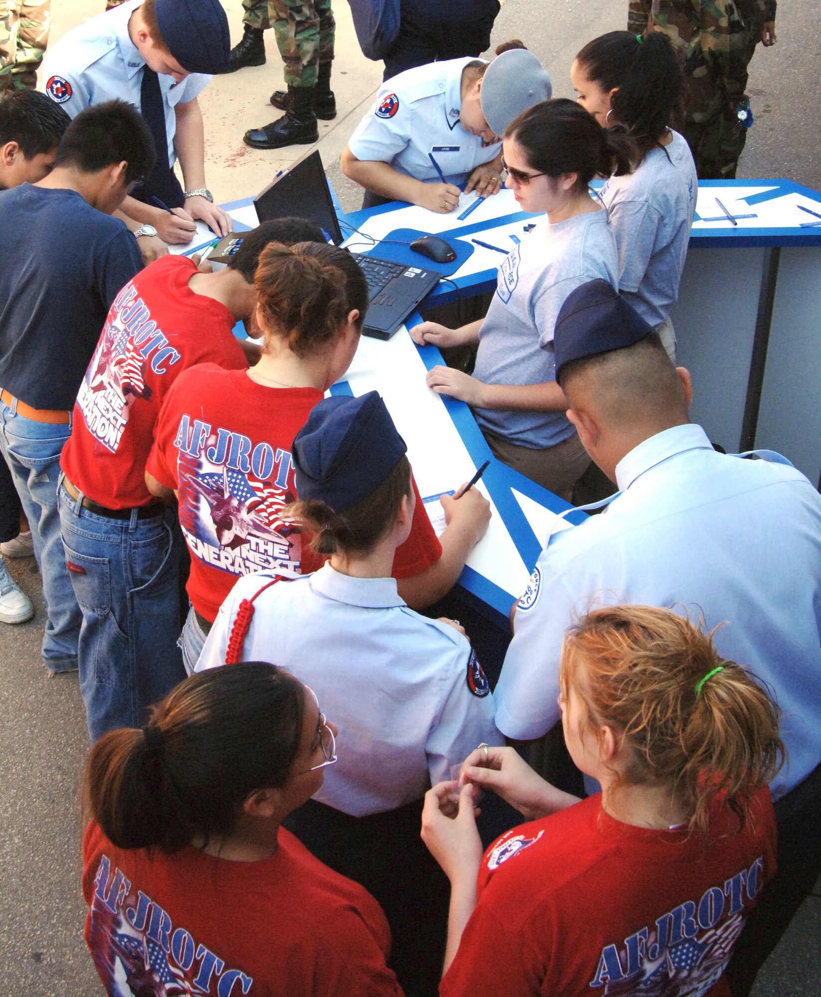 Students sign up for information about careers in the Air Force Tuesday, April 4, 2006 at a San Antonio high school. The event had video games and a semi-trailer with a short video shown inside about career opportunities and experiences in the Air Force. (U.S. Air Force photo/Tech. Sgt. Larry A. Simmons)