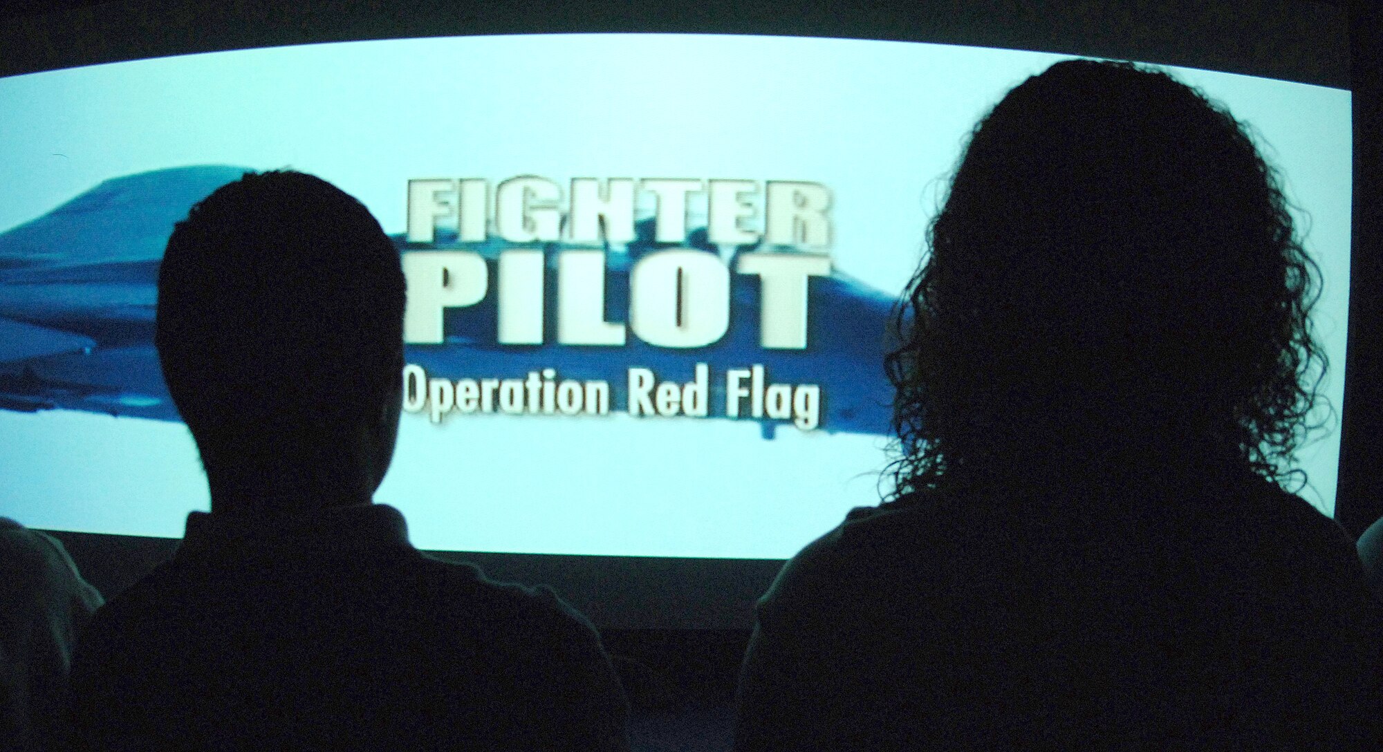 High school students watch a video about joining the Air Force during a recruiting event Tuesday, April 4, 2006 at a San Antonio high school. The event had video games and a semi-trailer with a short video shown inside about career opportunities and experiences in the Air Force. (U.S. Air Force photo/Tech. Sgt. Larry A. Simmons)